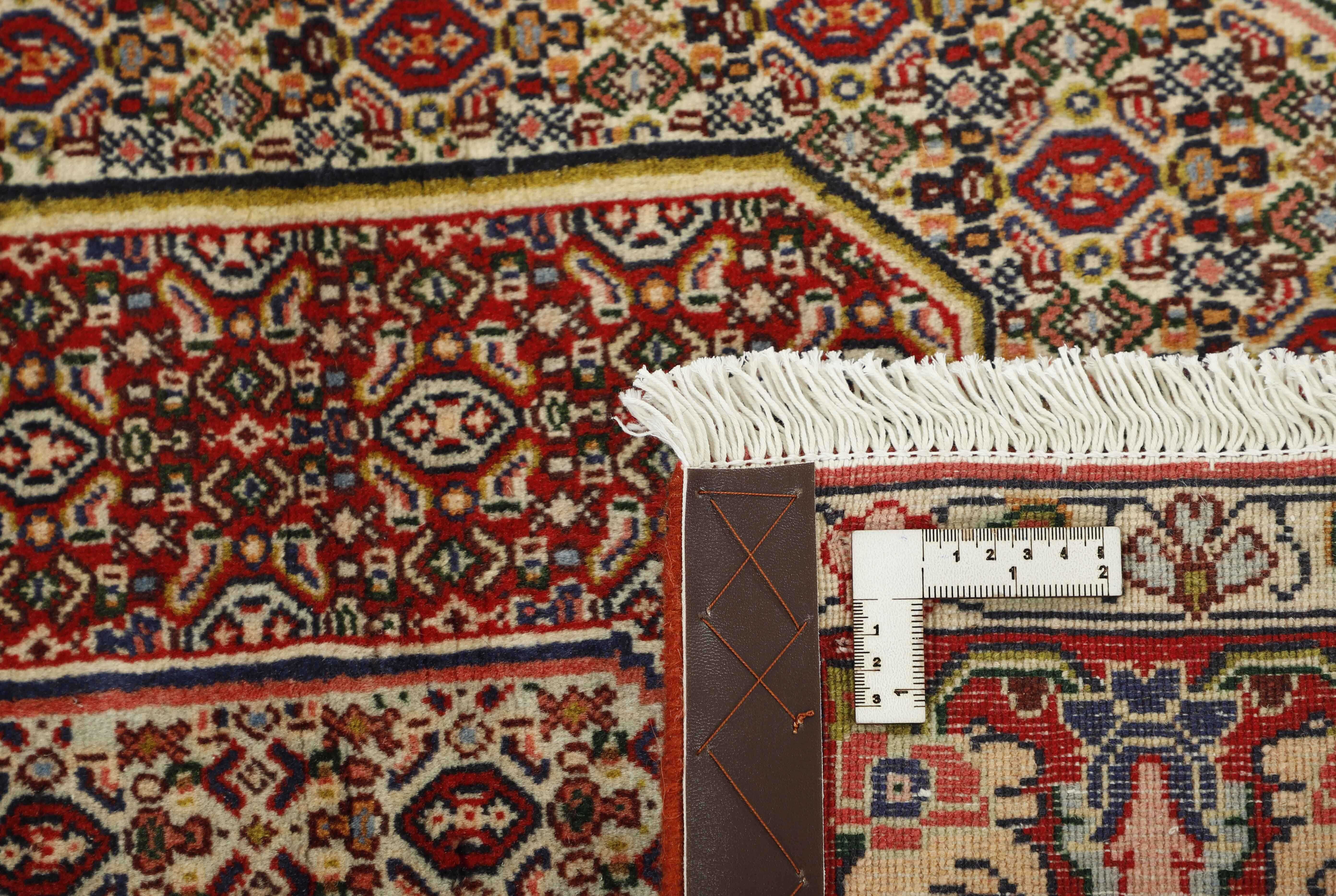 authentic persian rug with a traditional geometric design in multicolour