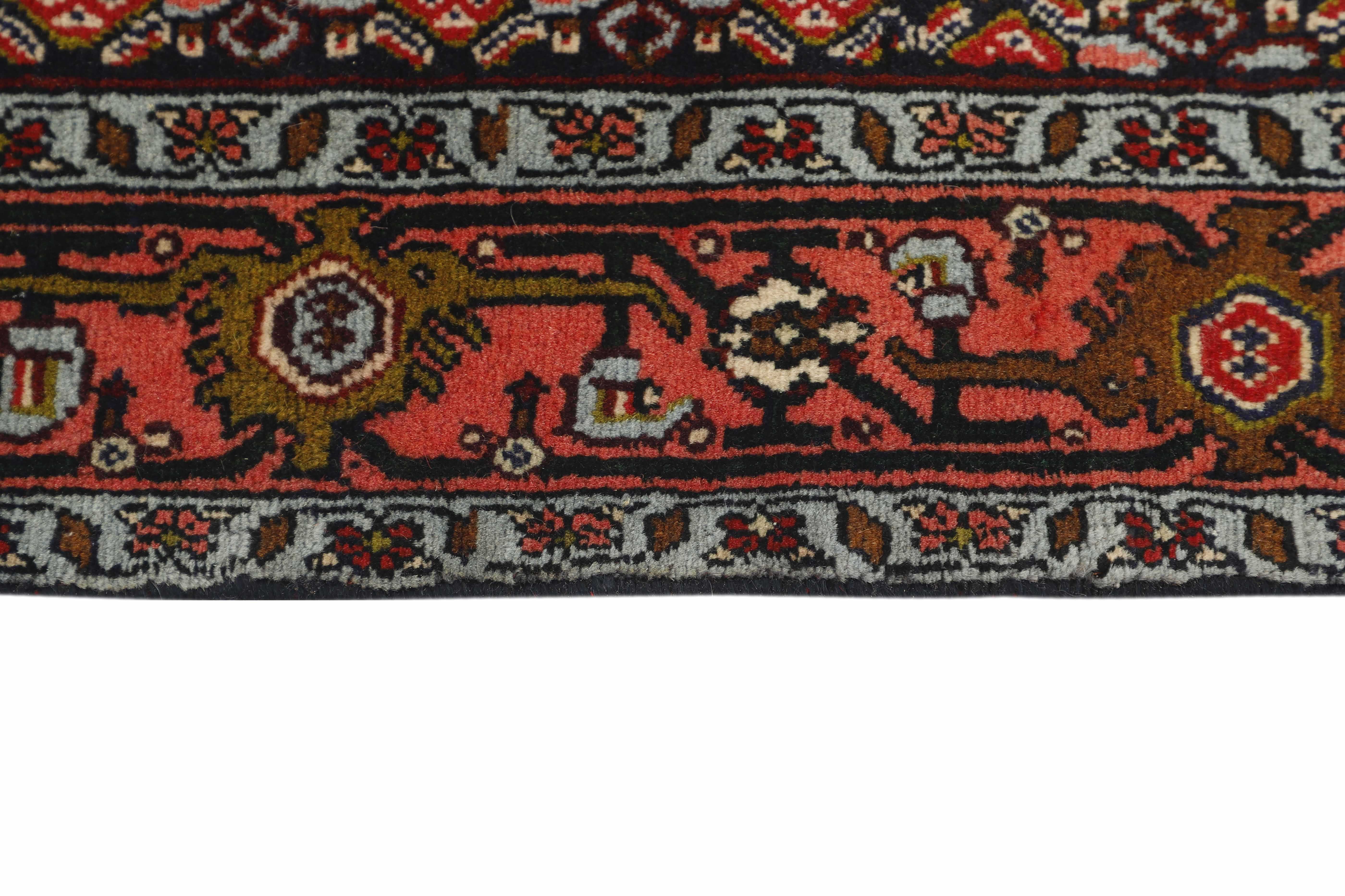 authentic persian rug with a traditional geometric design in red