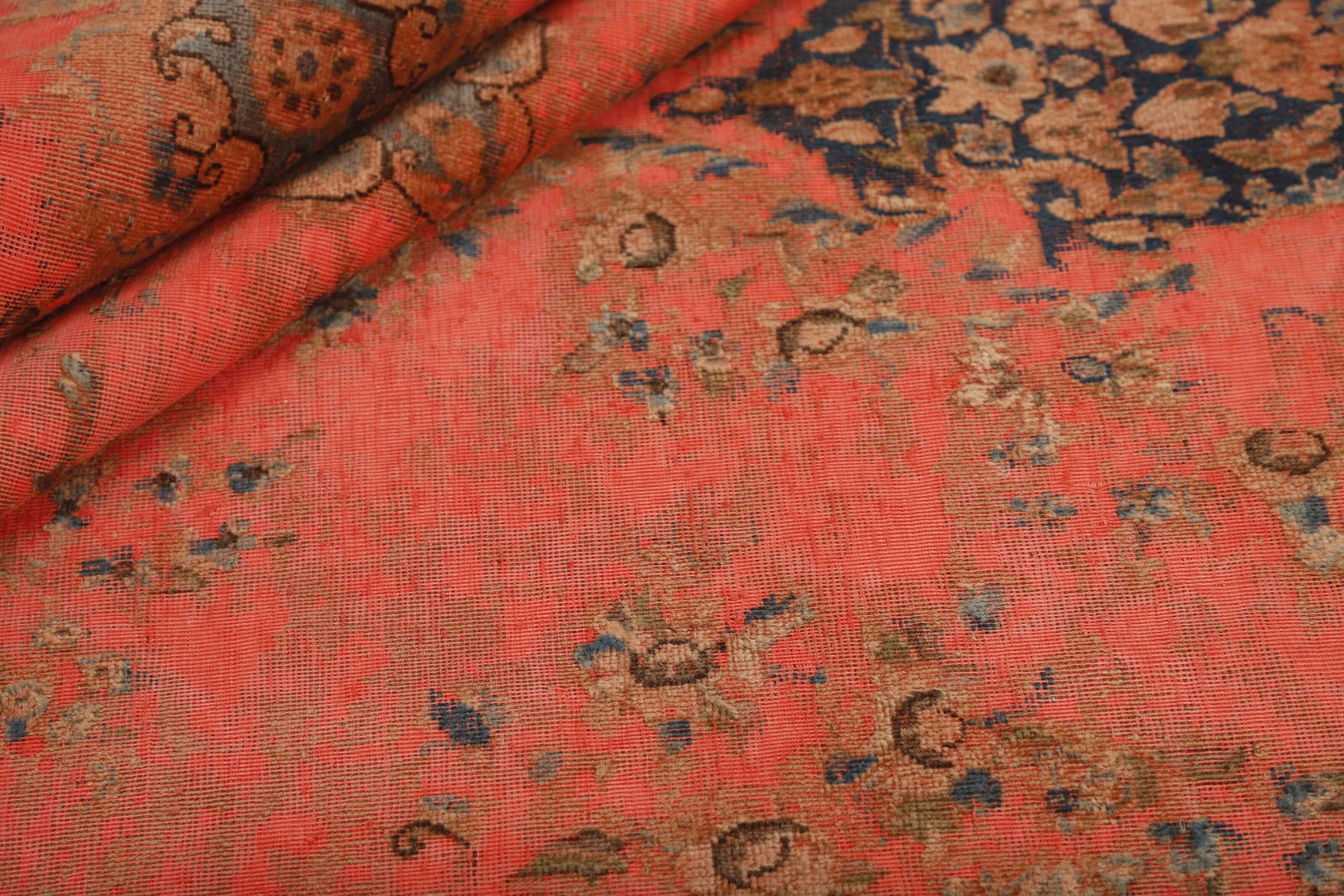 Red distressed bordered vintage Persian-style rug