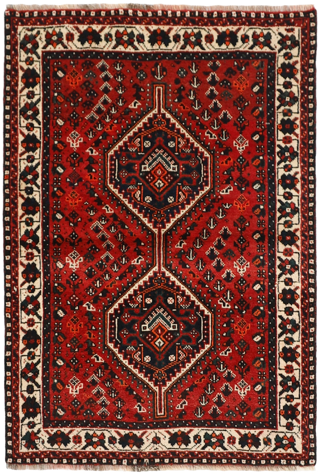 Authentic persian rug with a traditional tribal geometric pattern in red