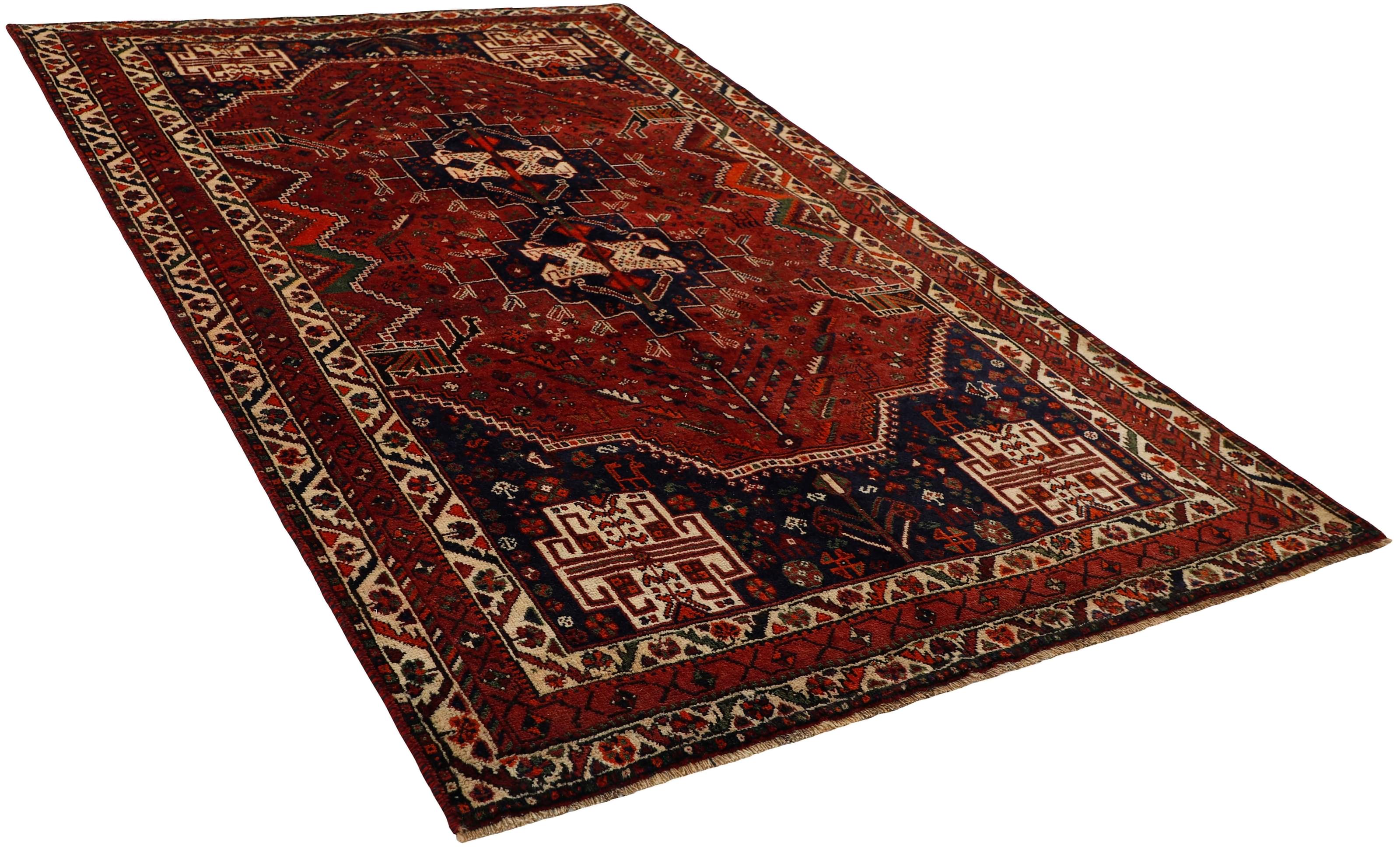 Authentic persian rug with a traditional tribal geometric pattern in red