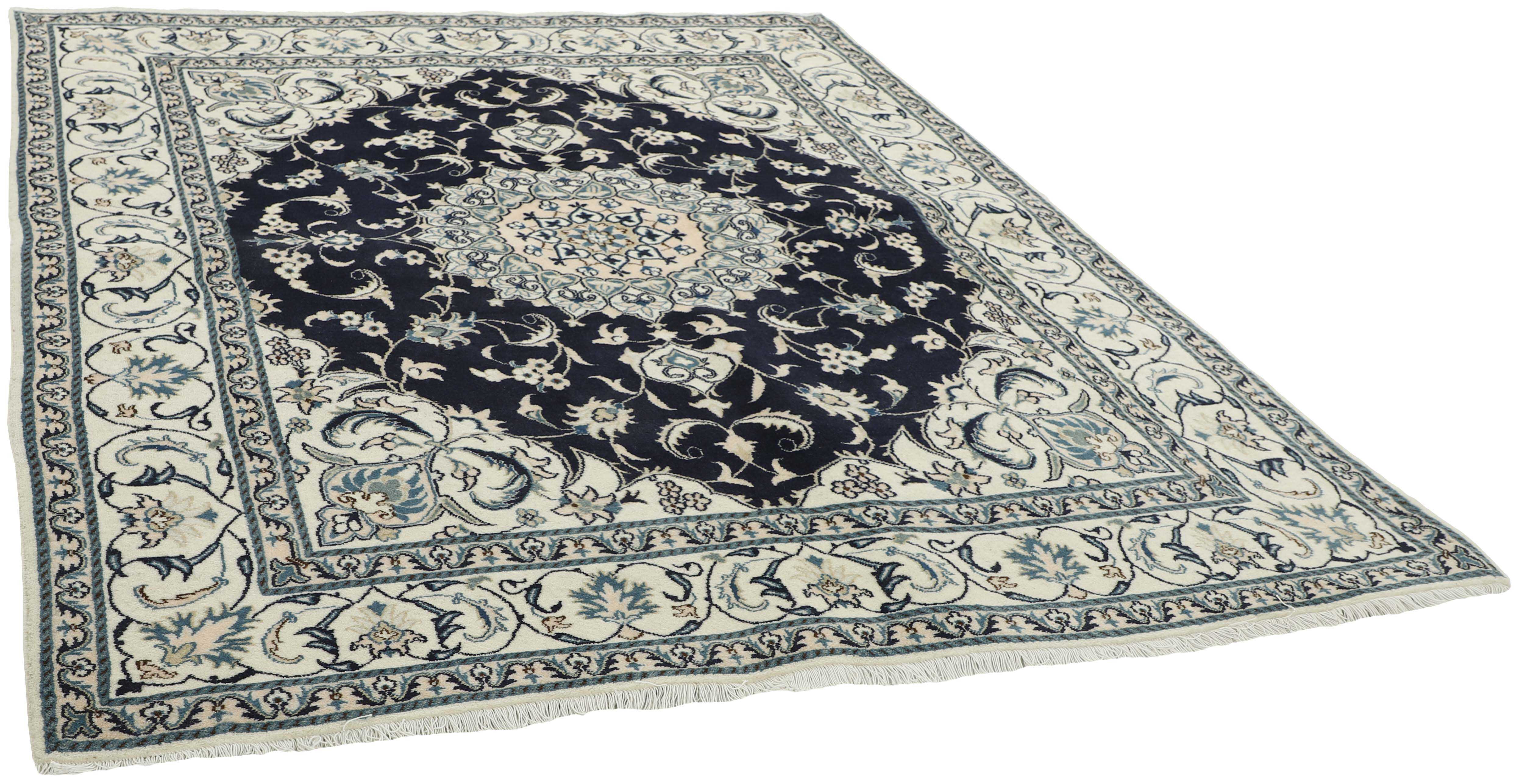 Authentic persian rug with a traditional floral design in cream and blue