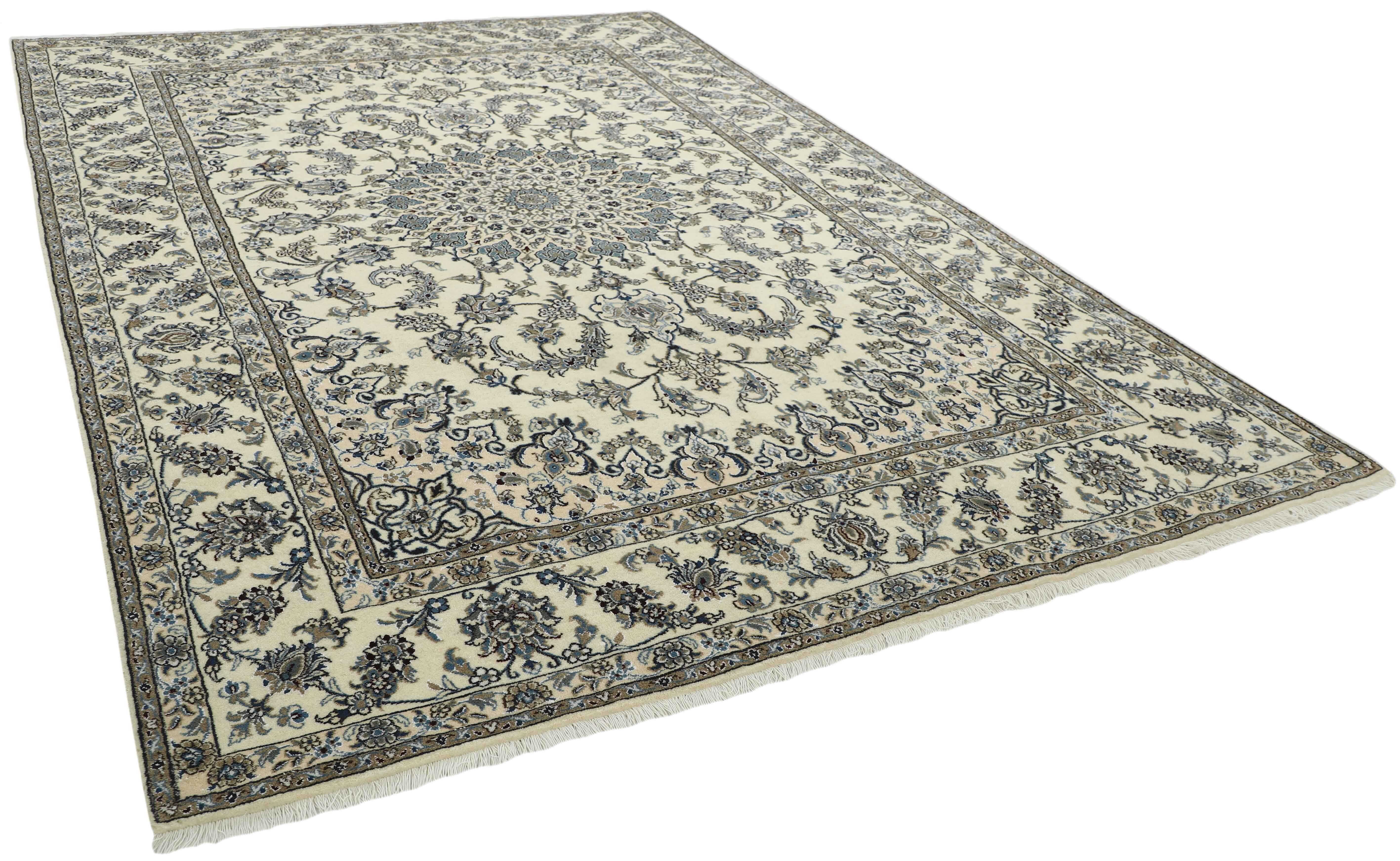 Authentic persian rug with a traditional floral design in beige and blue