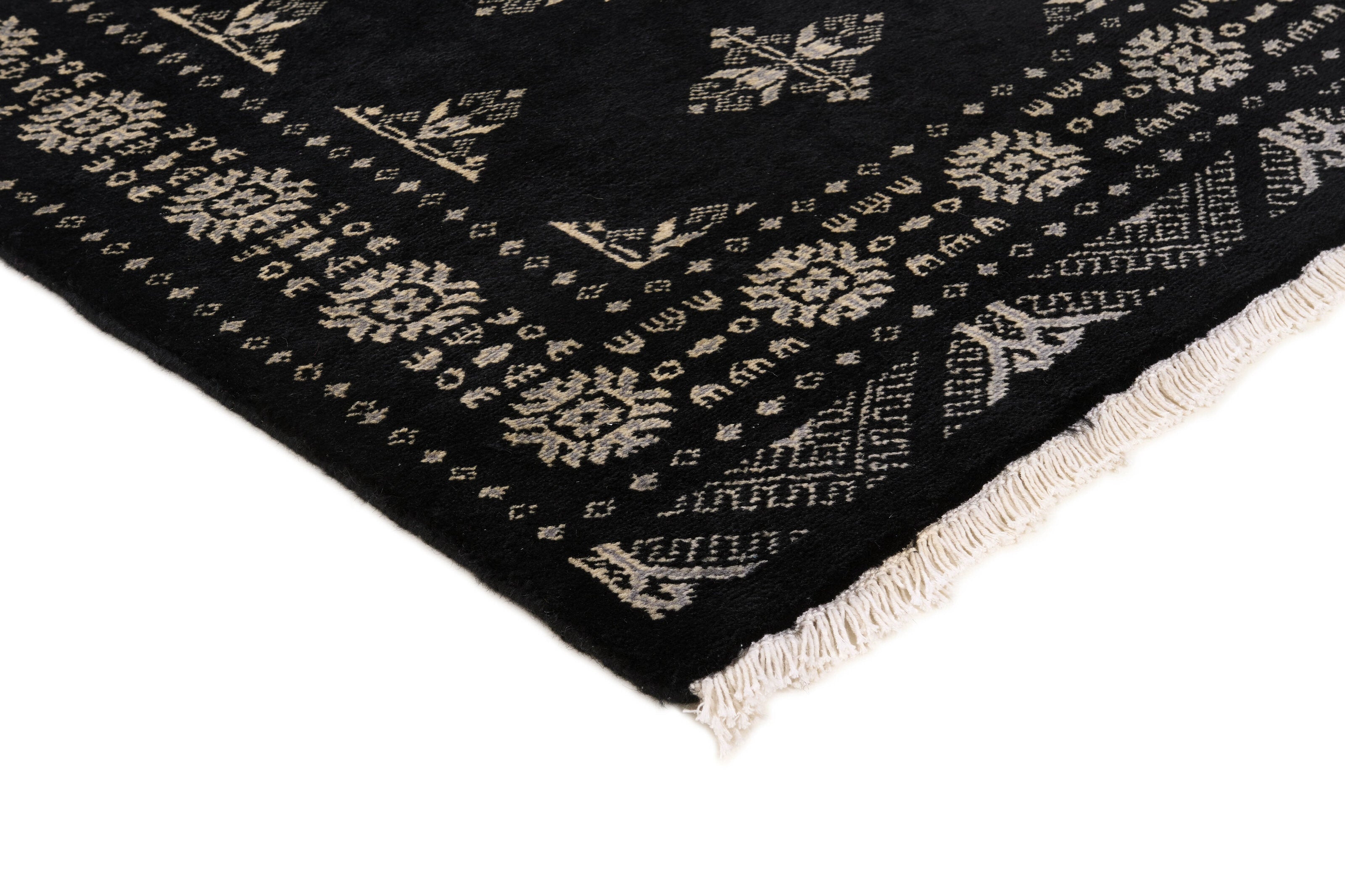 Black Oriental rug with traditional bordered pattern