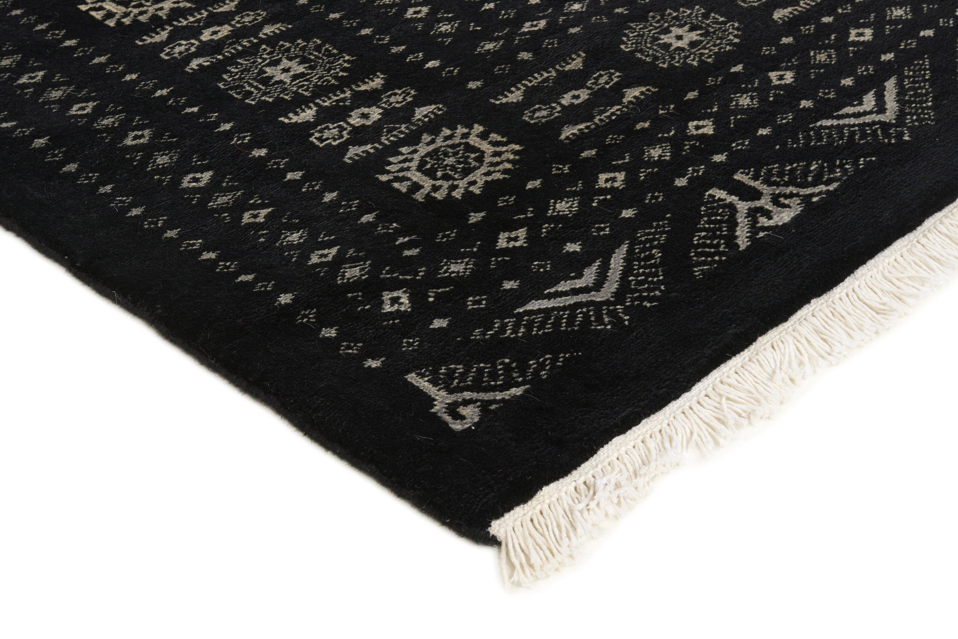 Black Oriental rug with traditional bordered pattern