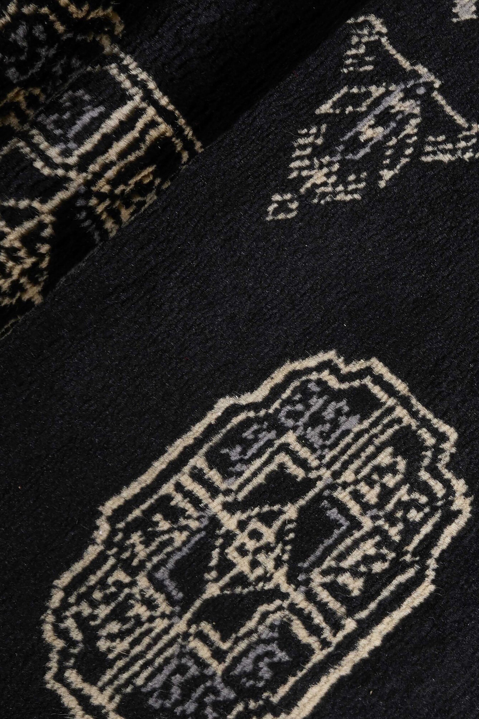 Black Oriental runner with traditional bordered pattern
