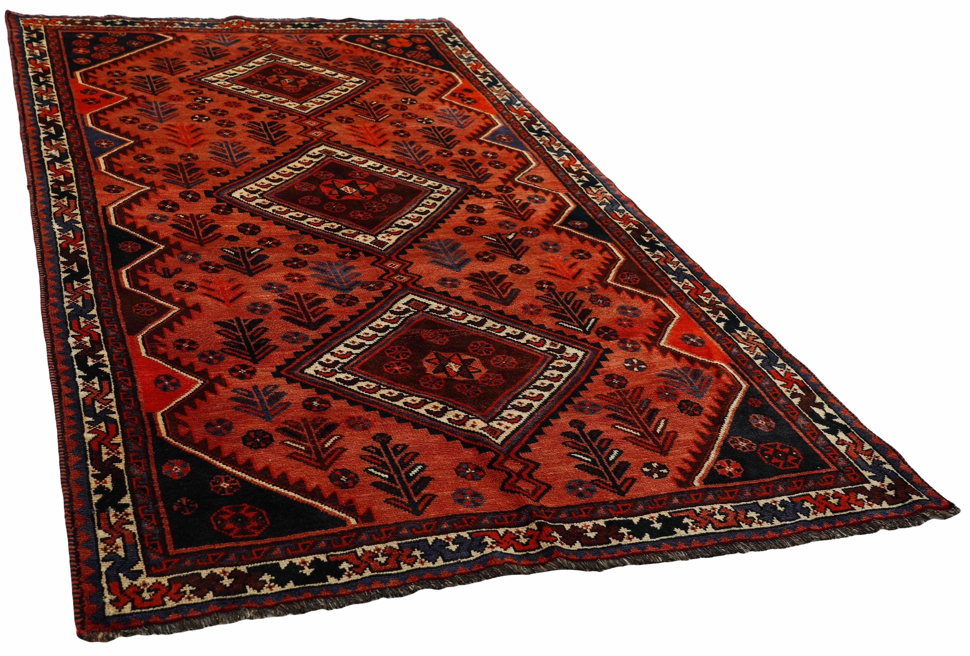 Authentic persian rug with a traditional tribal geometric pattern in red