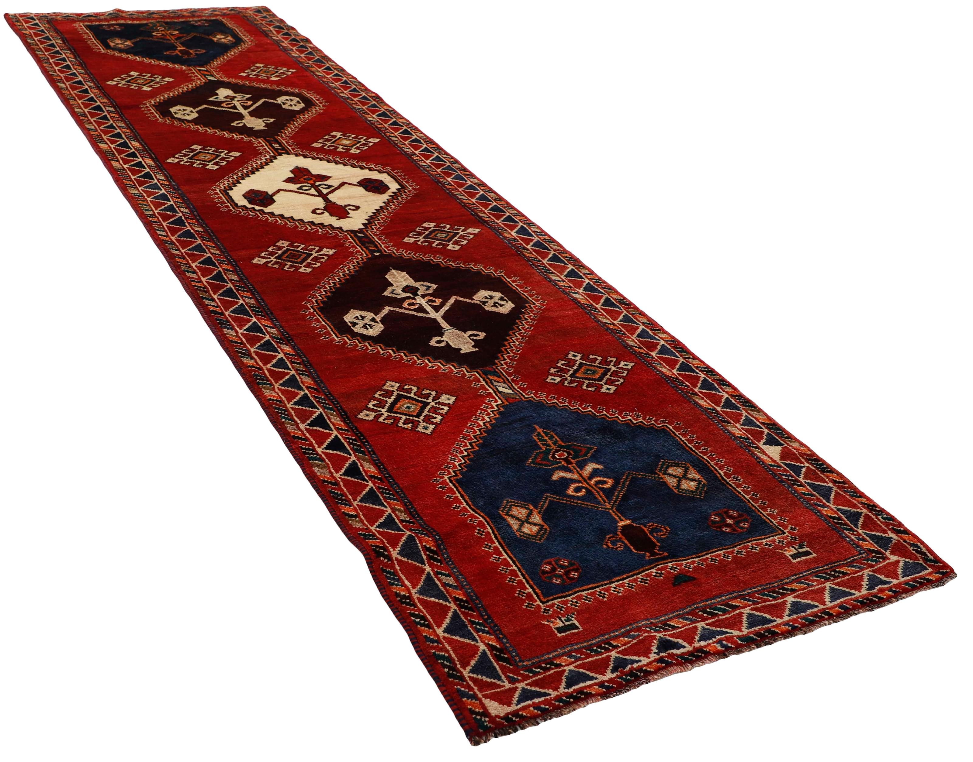 Authentic persian rug with a traditional tribal geometric pattern in red