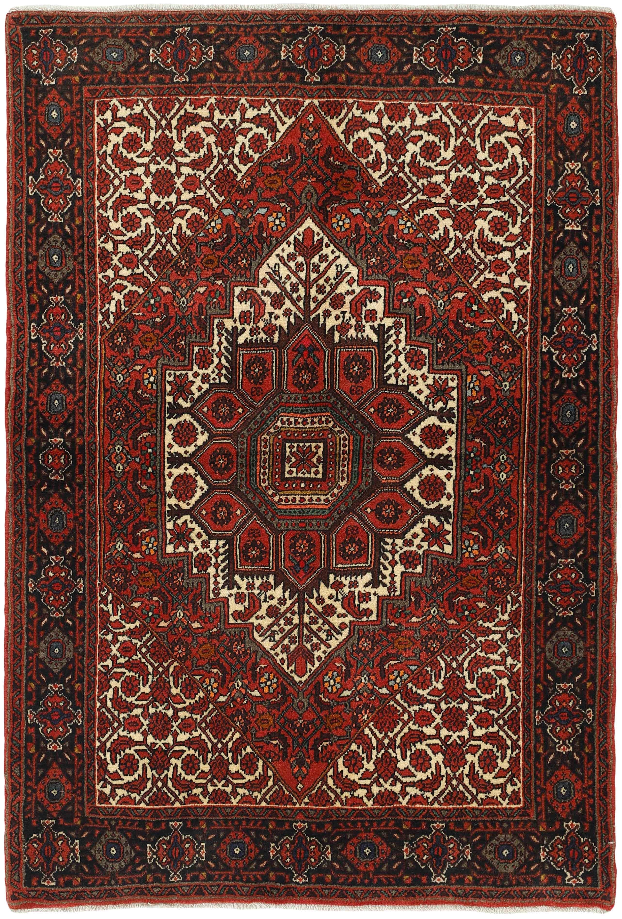 Red and beige persian rug with a floral design