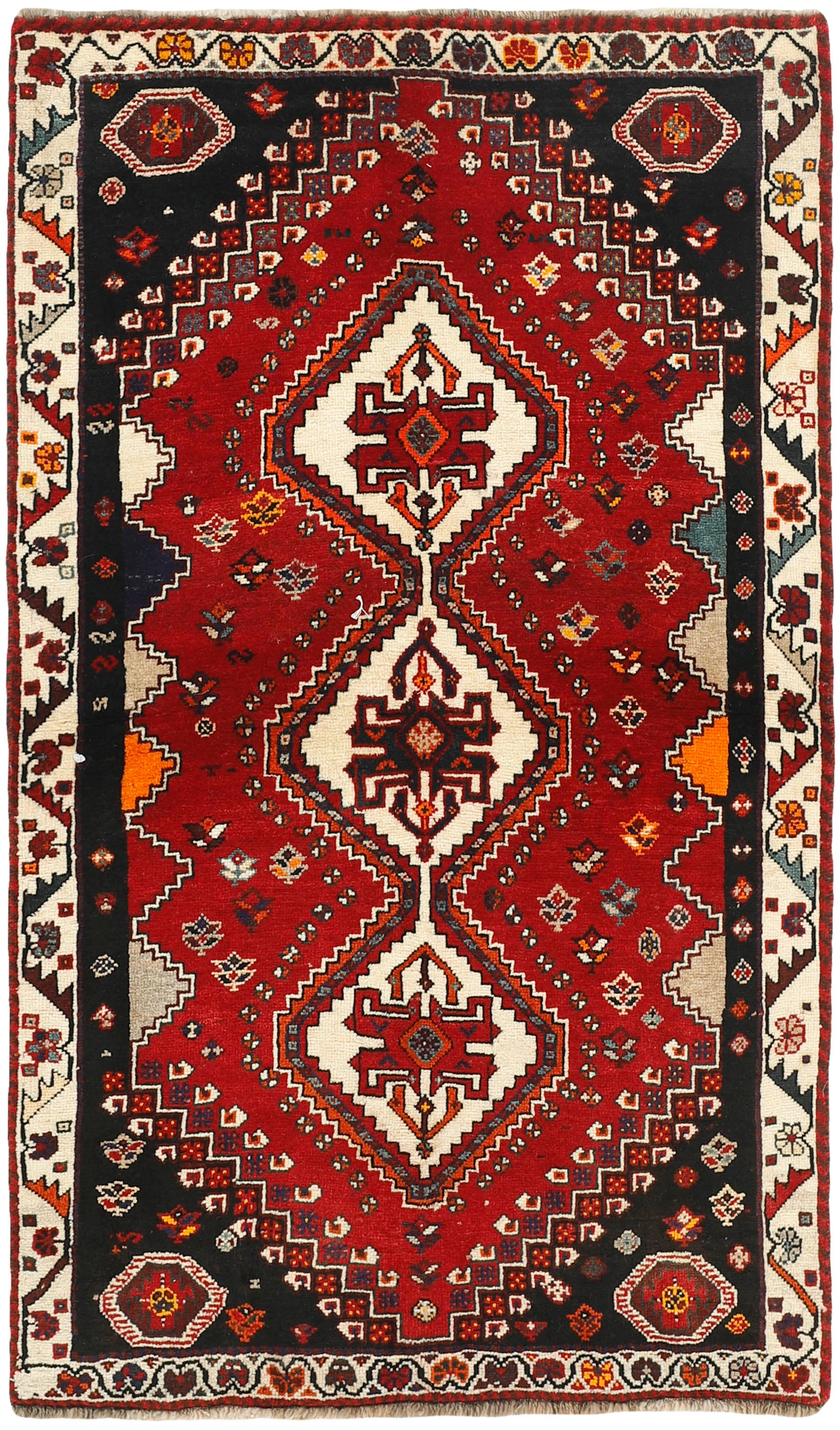 red and black persian rug with geometric design
