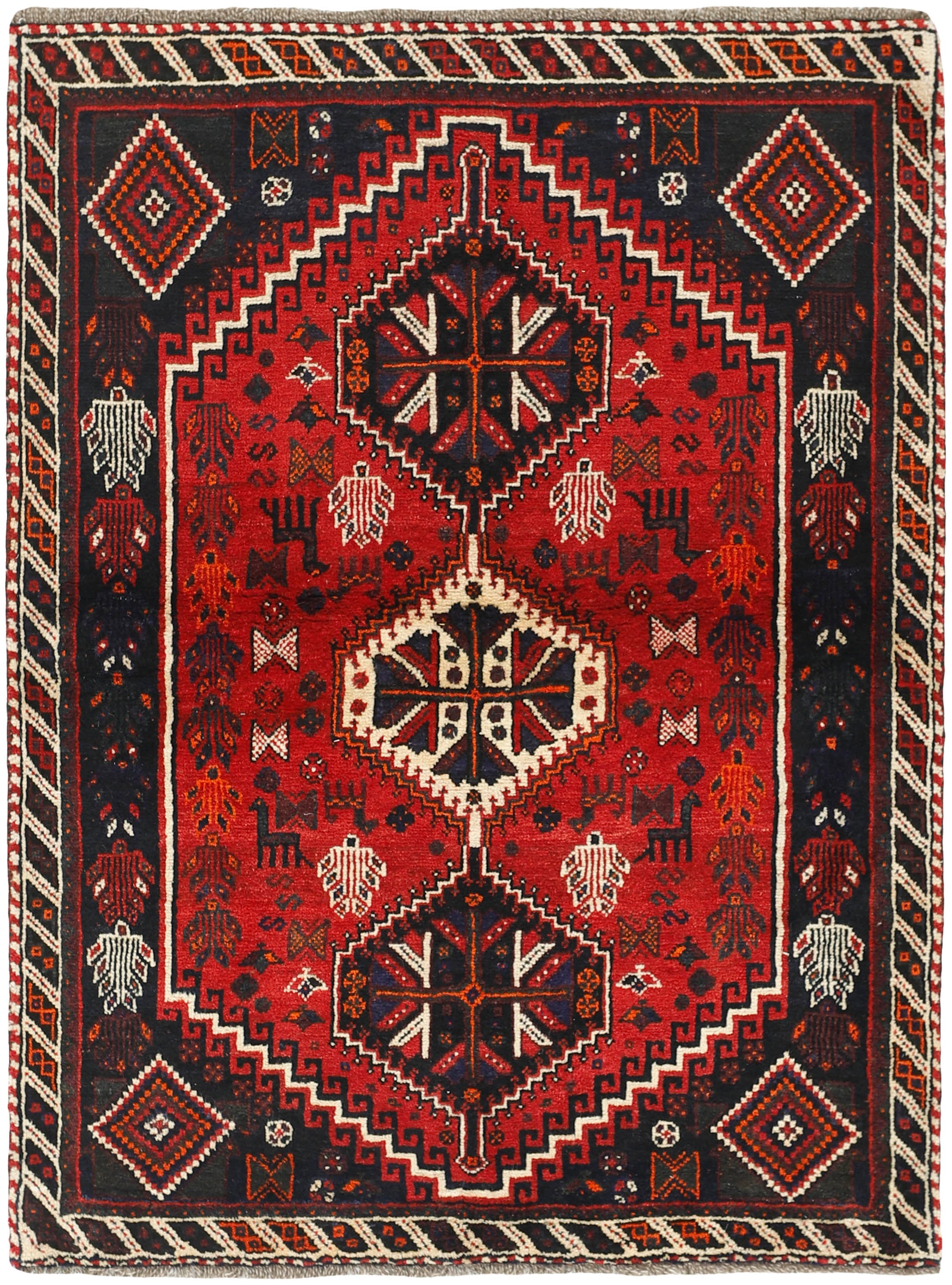 Authentic persian rug with a traditional tribal geometric pattern in red, black and ivory