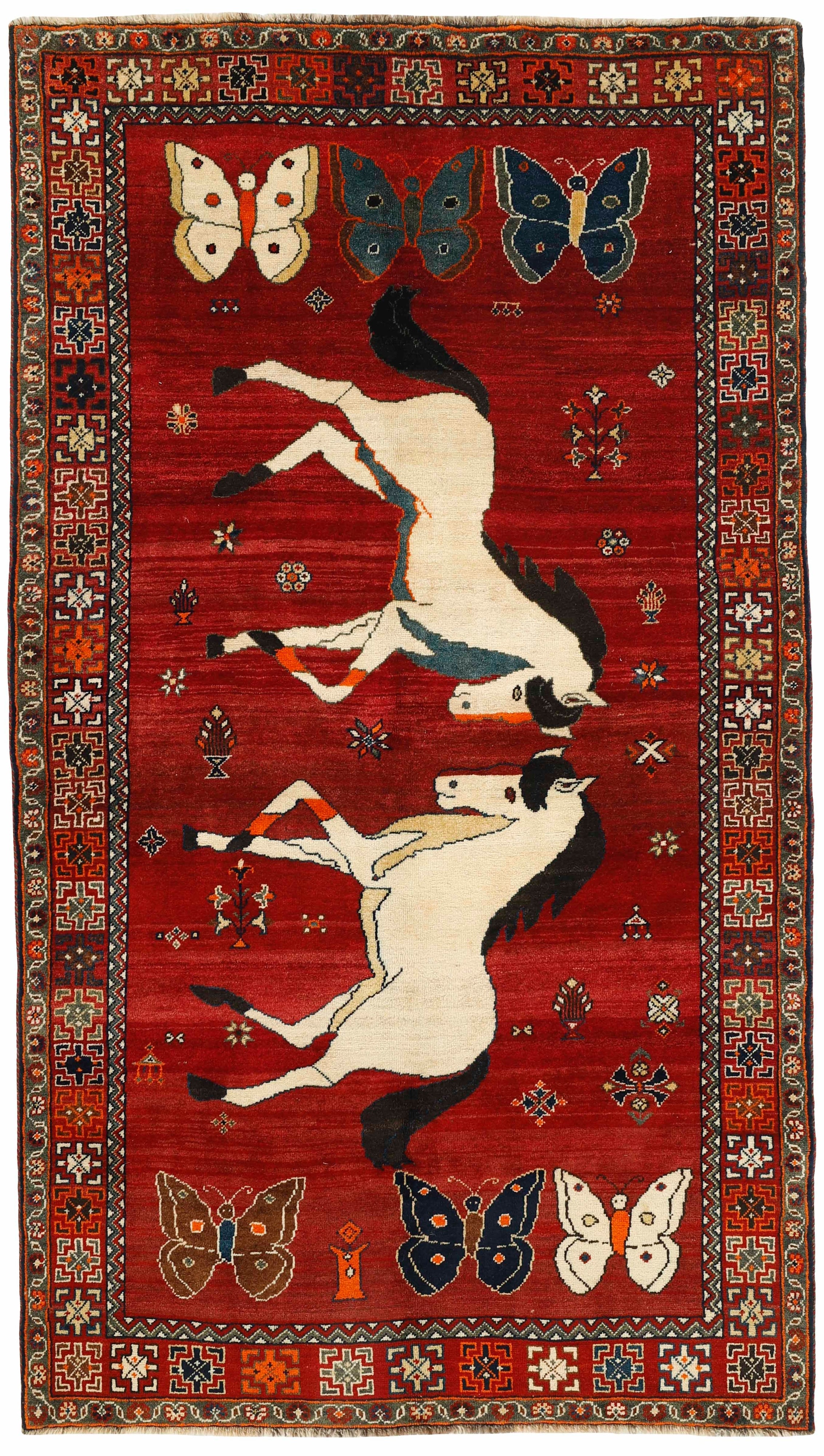 red persian rug with figural design