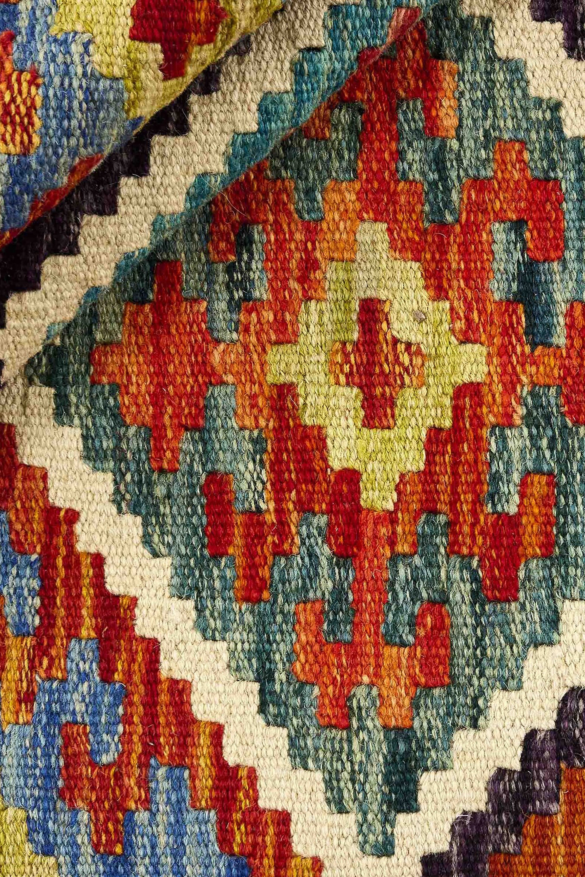Authentic Afghan Kelim flatweave rug with traditional multicolour pattern.

