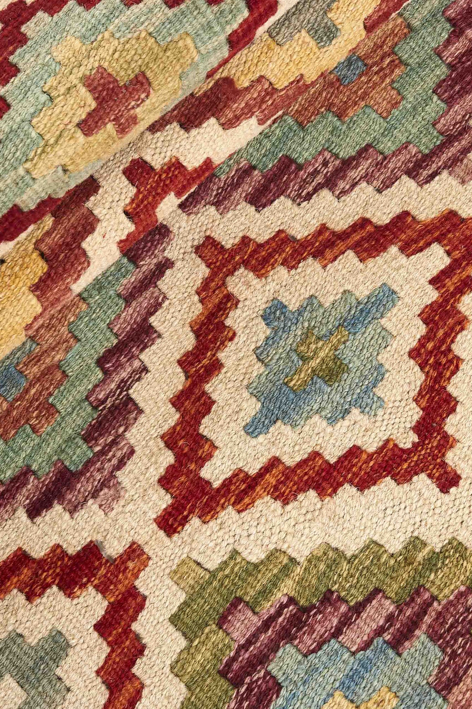 Authentic Afghan Kelim flatweave rug with traditional multicolour pattern.