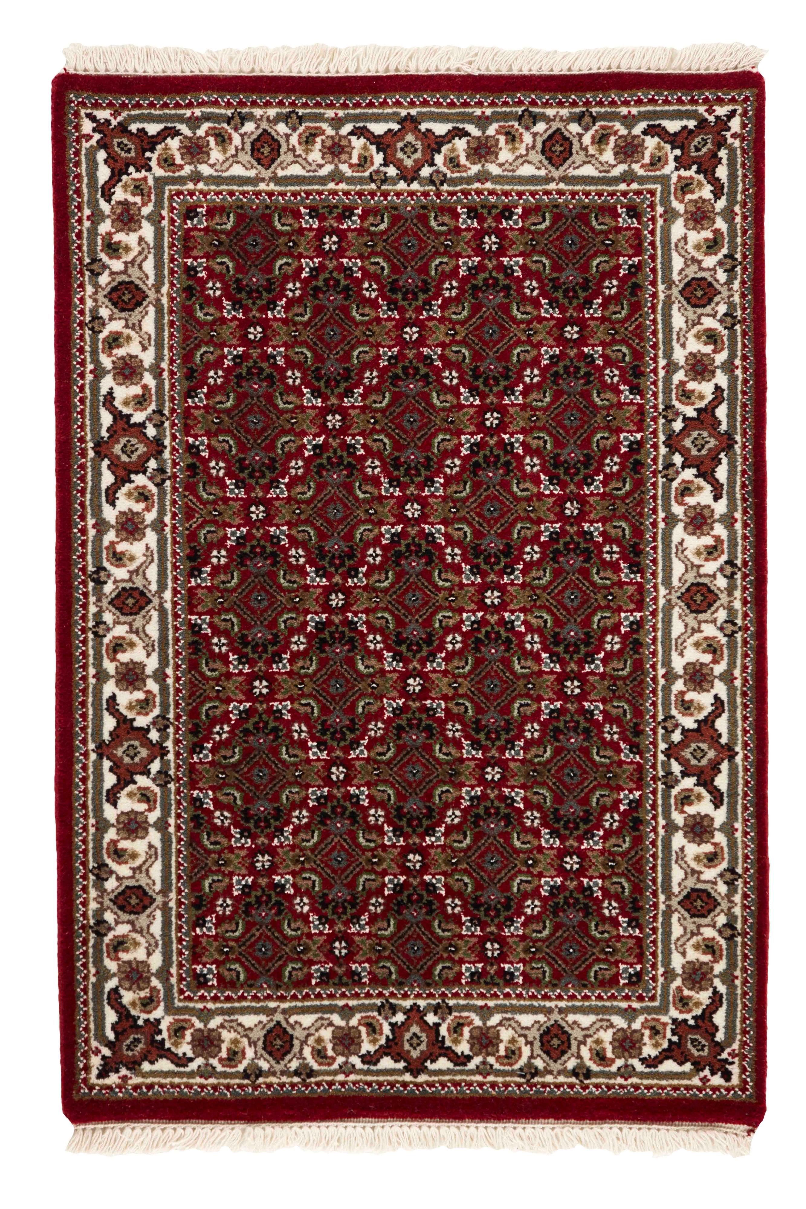 Authentic Oriental rug with traditional geometric and floral design in beige, blue, green and black