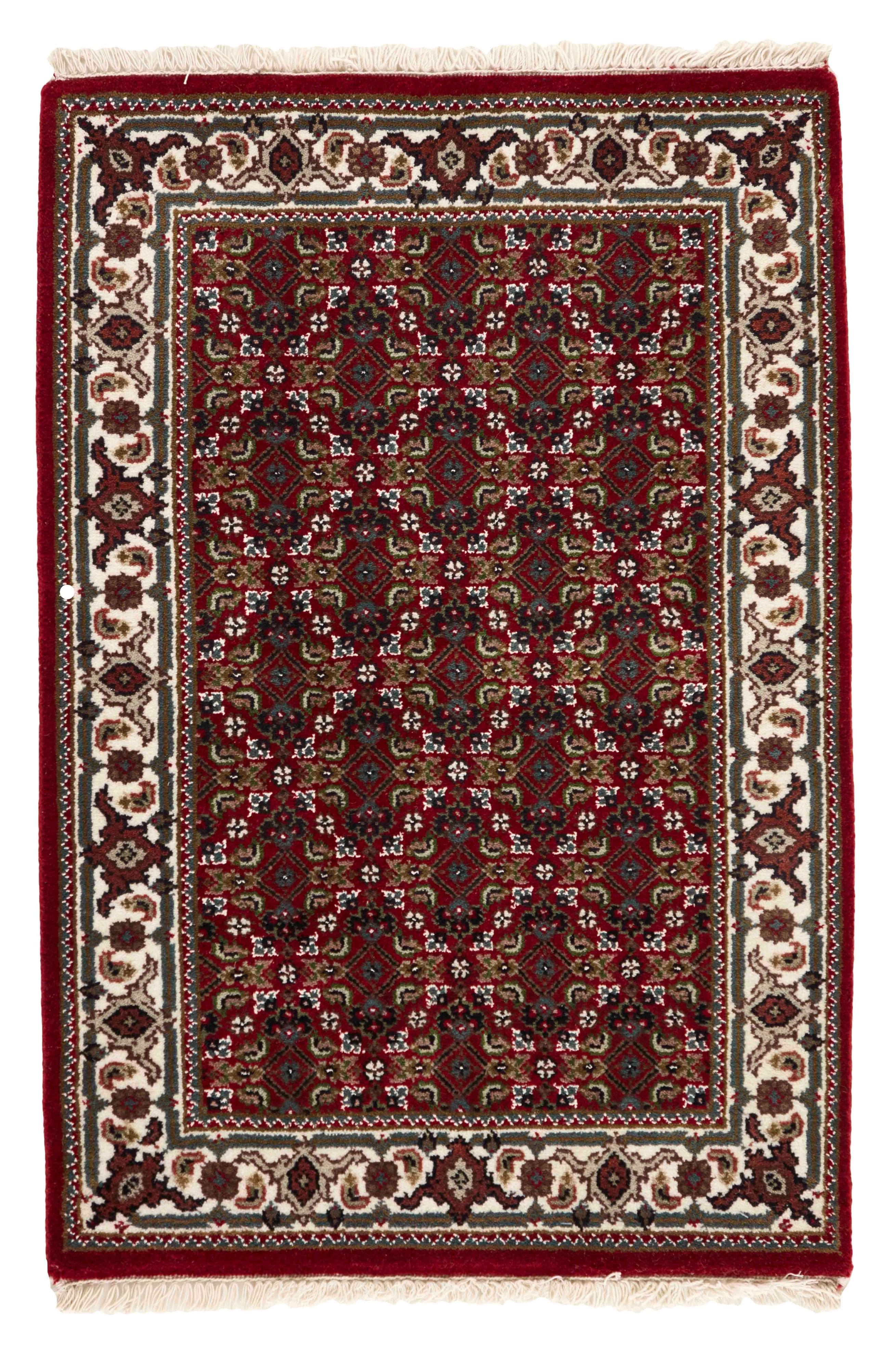 Authentic Oriental rug with traditional geometric and floral design in beige, blue, green and black