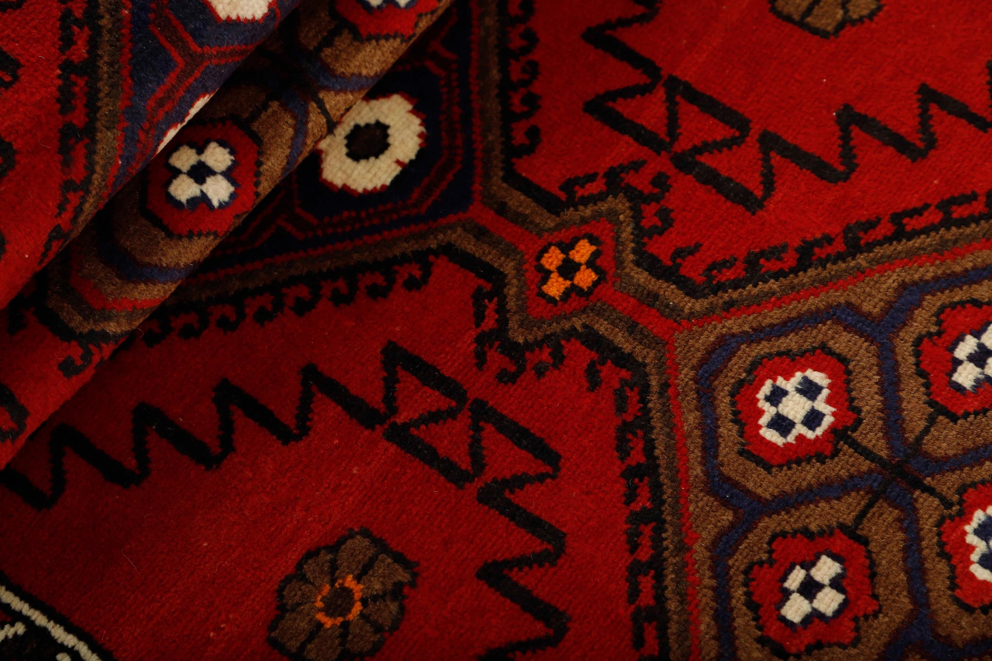 Red and black traditional persian runner with floral design