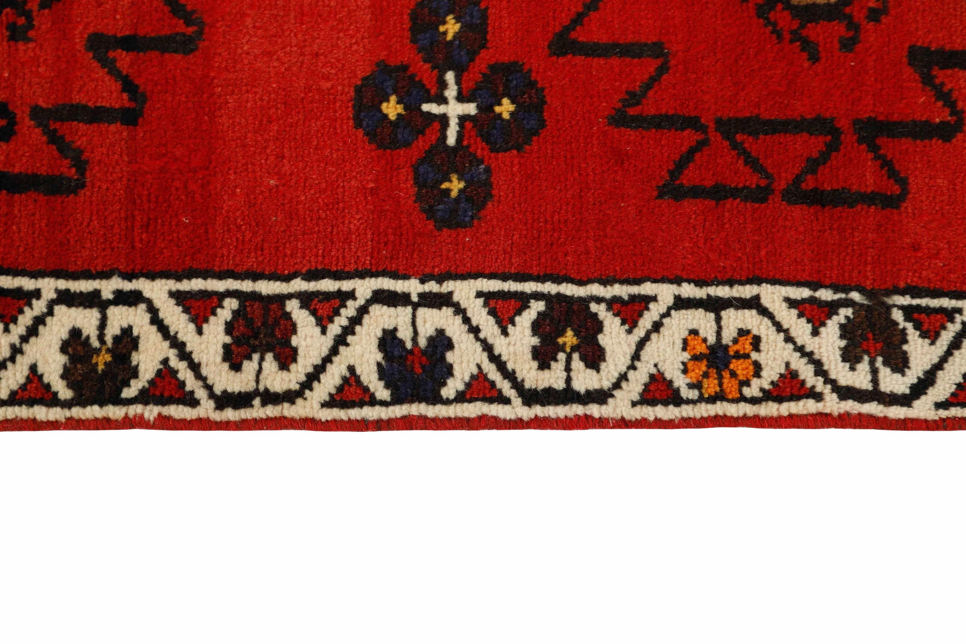 Red and black traditional persian runner with floral design
