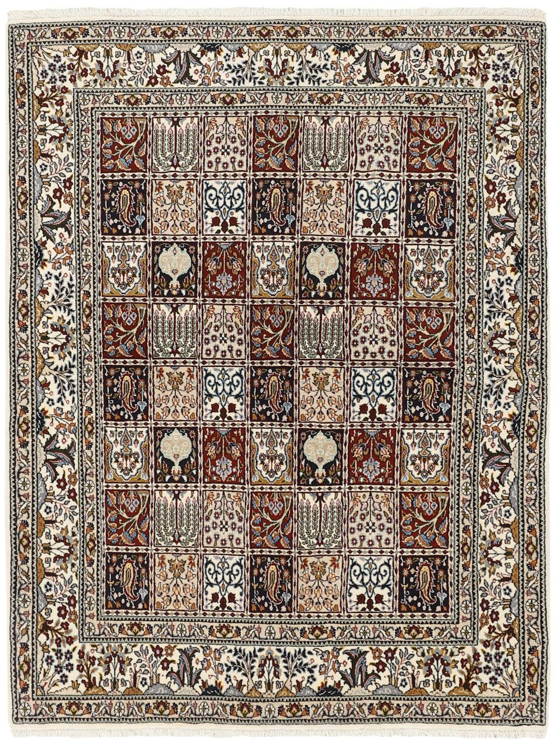 authentic persian rug with traditional floral pattern in cream, blue and red