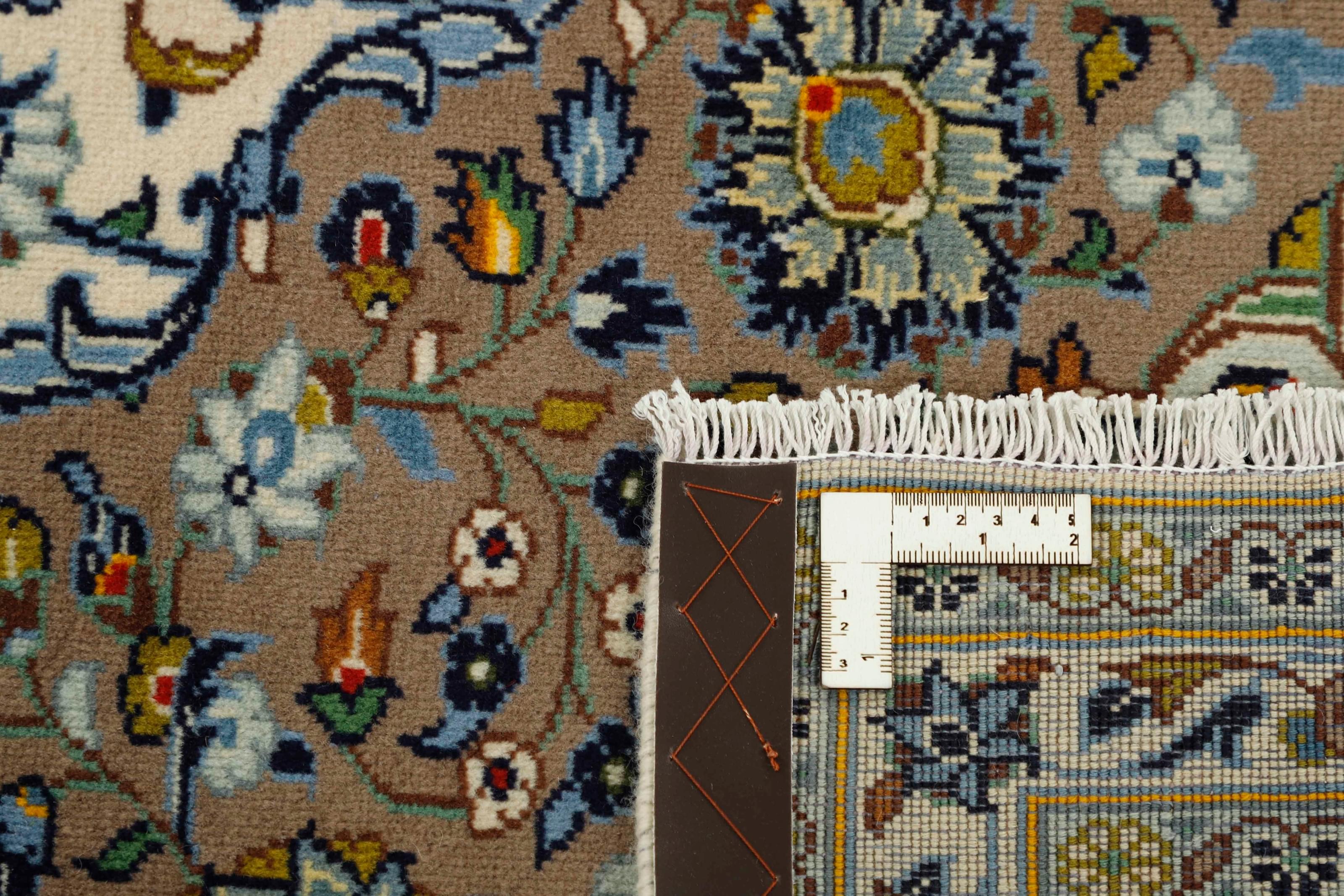 Authentic persian rug with traditional floral design in beige and blue