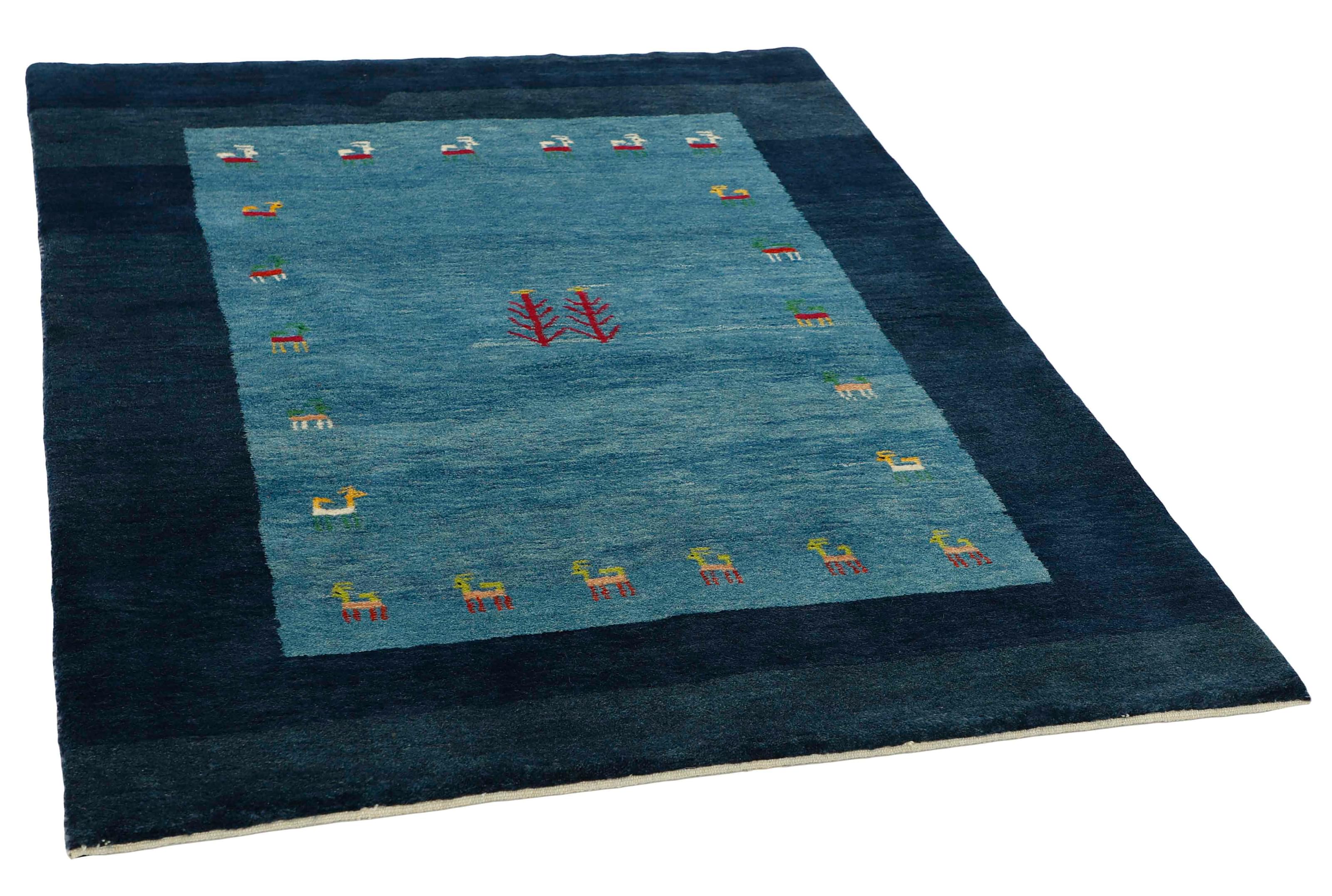authentic persian rug with geometric tribal design in beige, red, yellow and blue