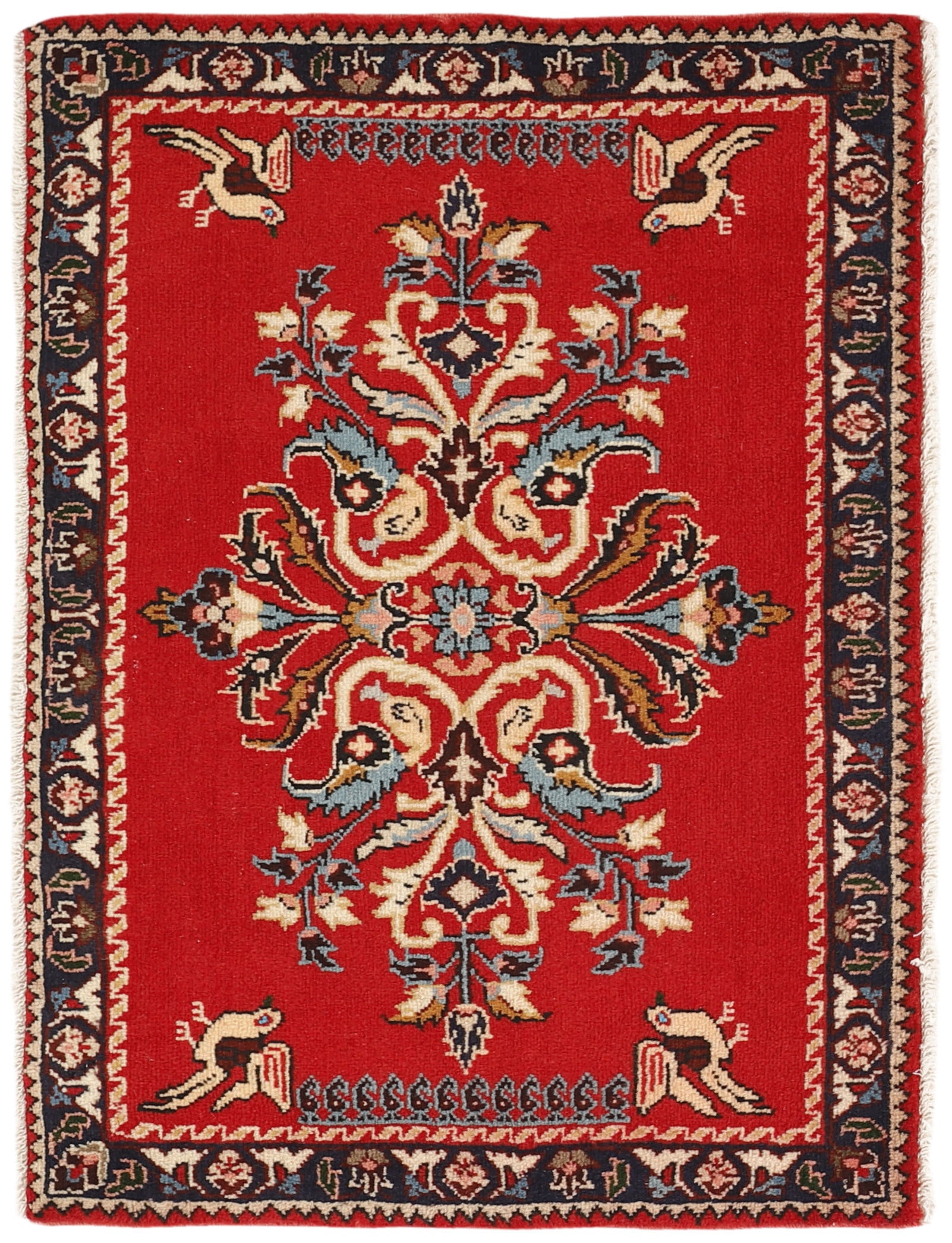 Traditional bordered Keshan rug with red background