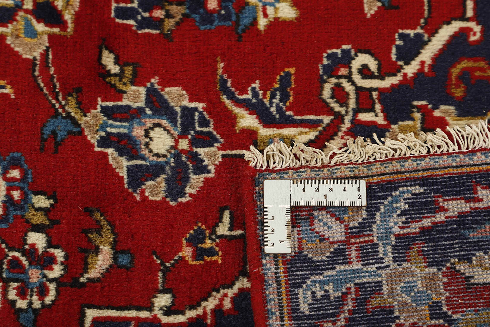 authentic persian rug with traditional floral pattern in cream