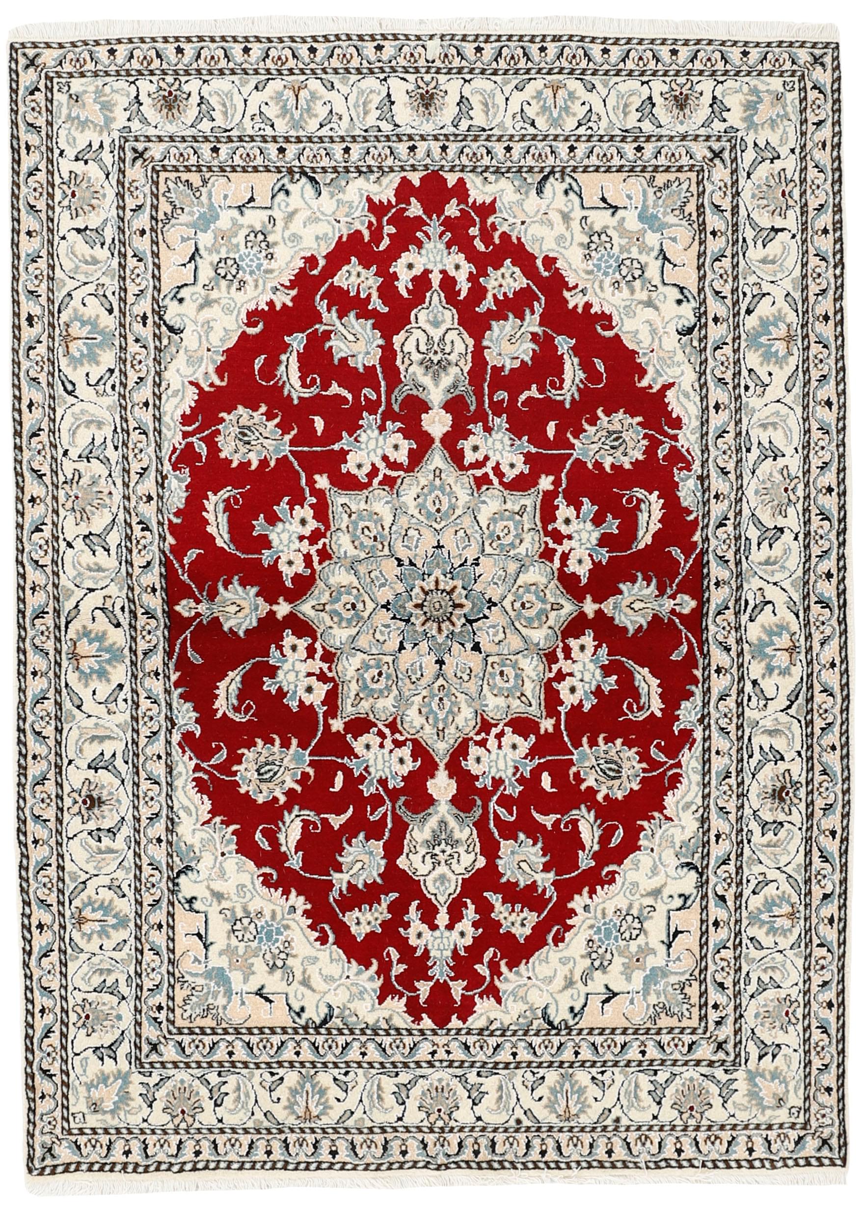 Authentic persian rug with a traditional floral design in red, cream and blue