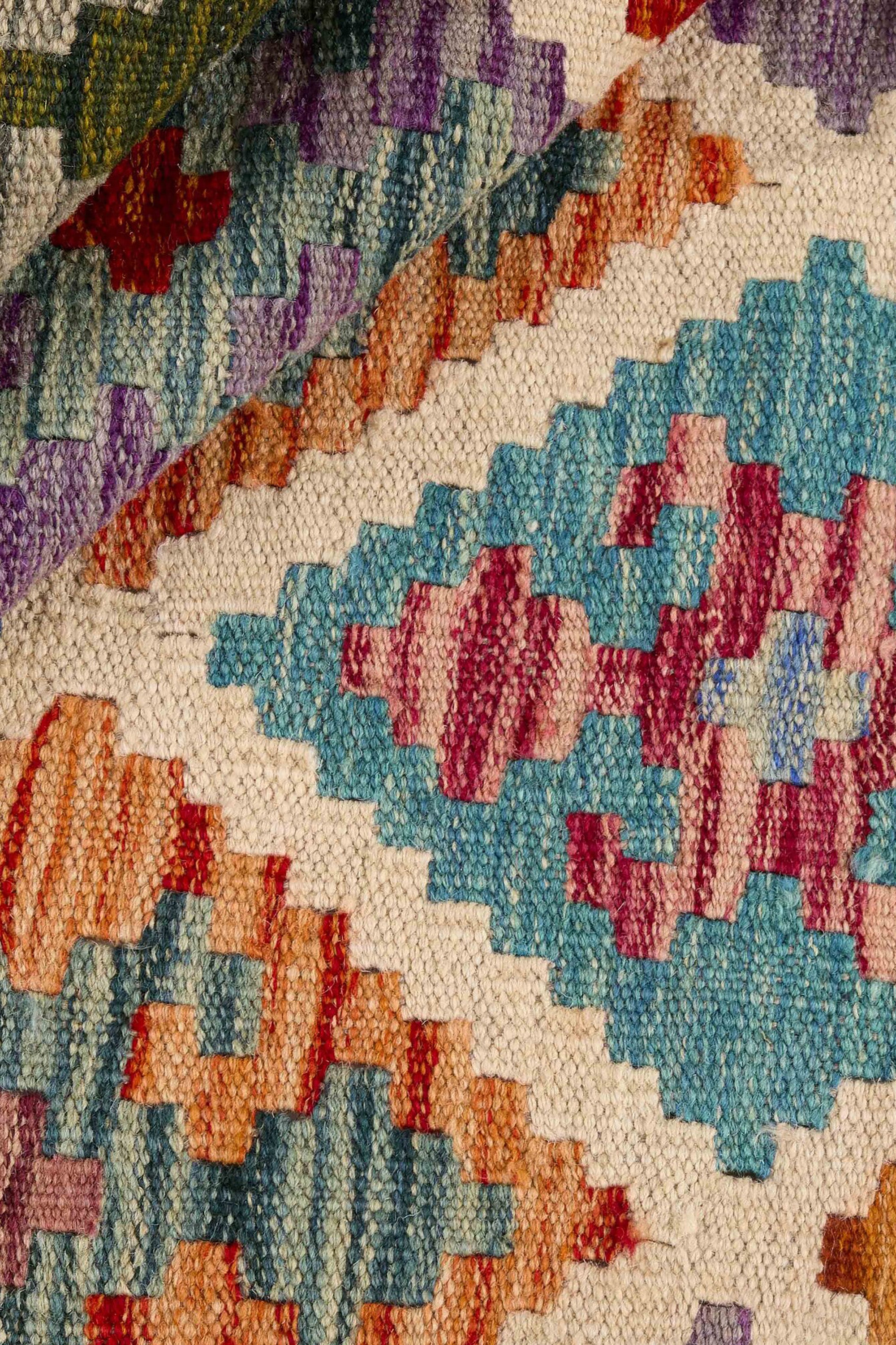 Authentic Afghan Kelim flatweave rug with traditional multicolour pattern.