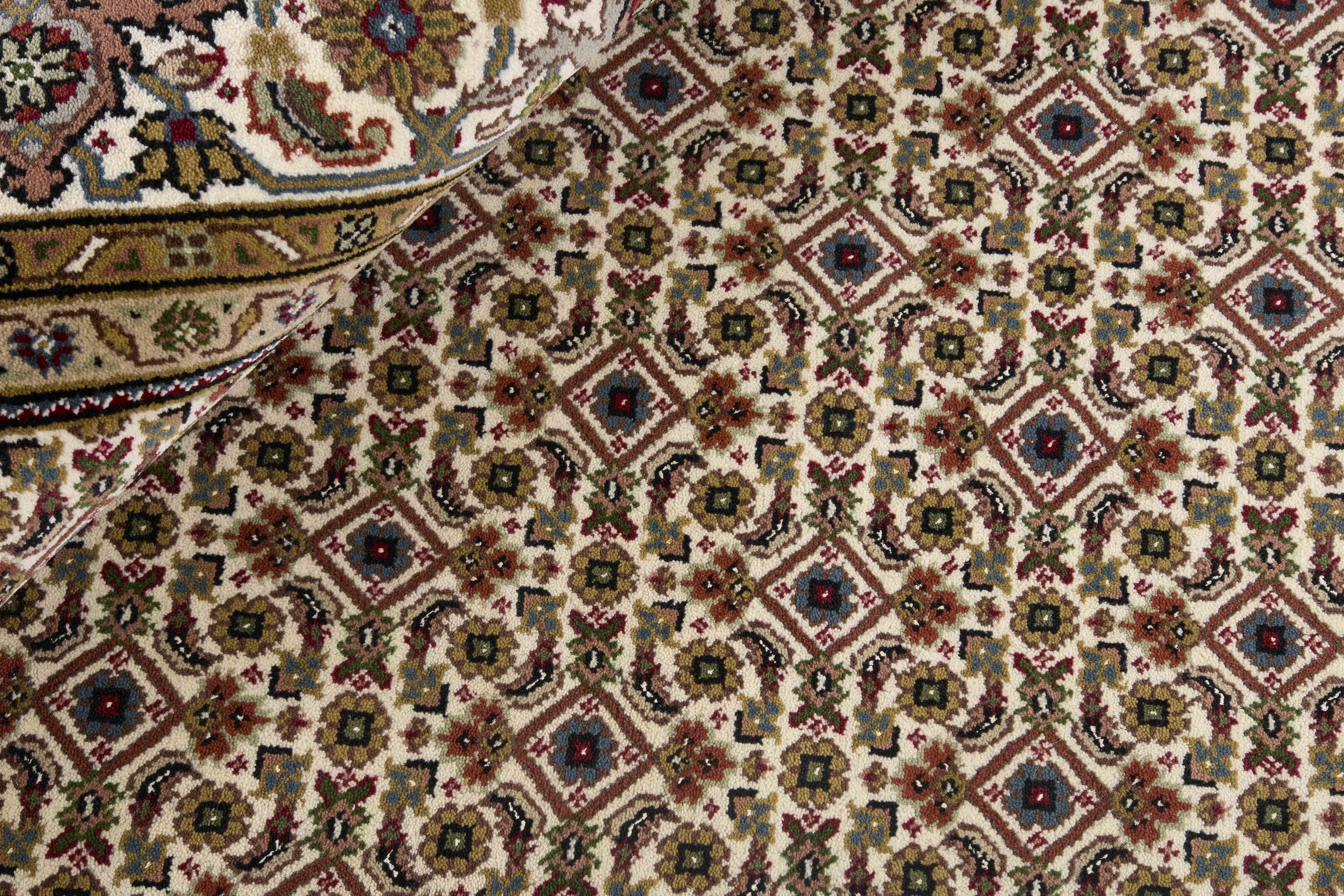 Authentic Oriental Tabriz Indi rug with multicolour floral bordered pattern