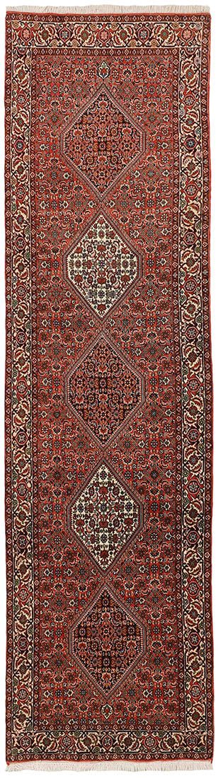 Red and cream persian runner with traditional floral design