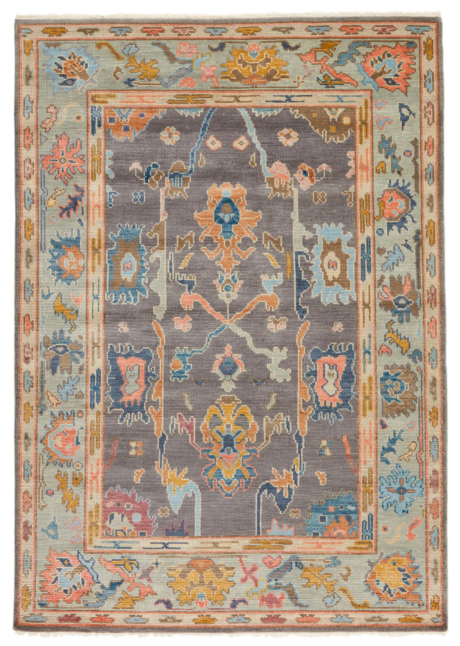 authentic Oriental rug with traditional motifs in red, pink, orange, yellow, blue, sky, green, beige, brown and grey