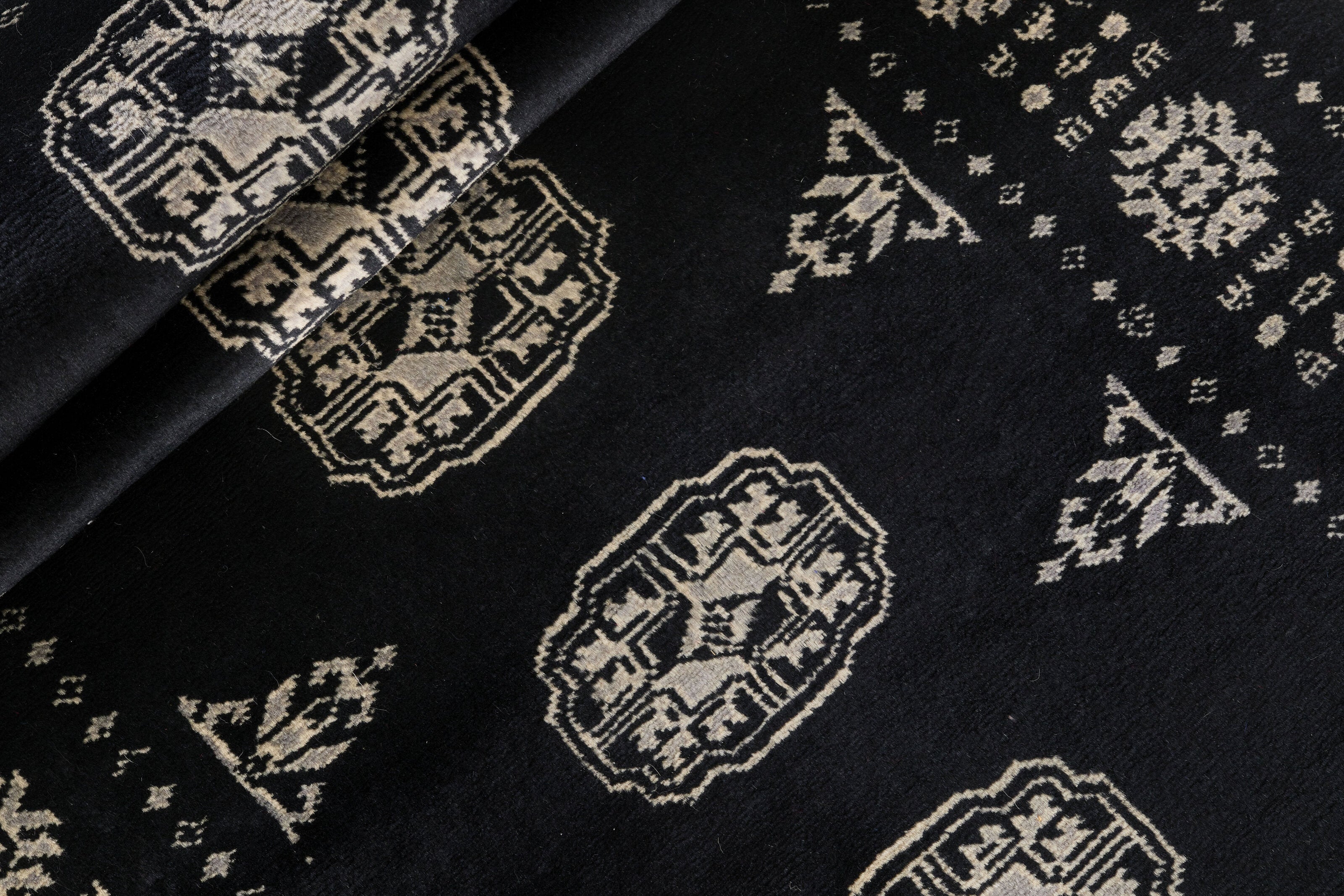 Black Oriental runner with traditional bordered pattern