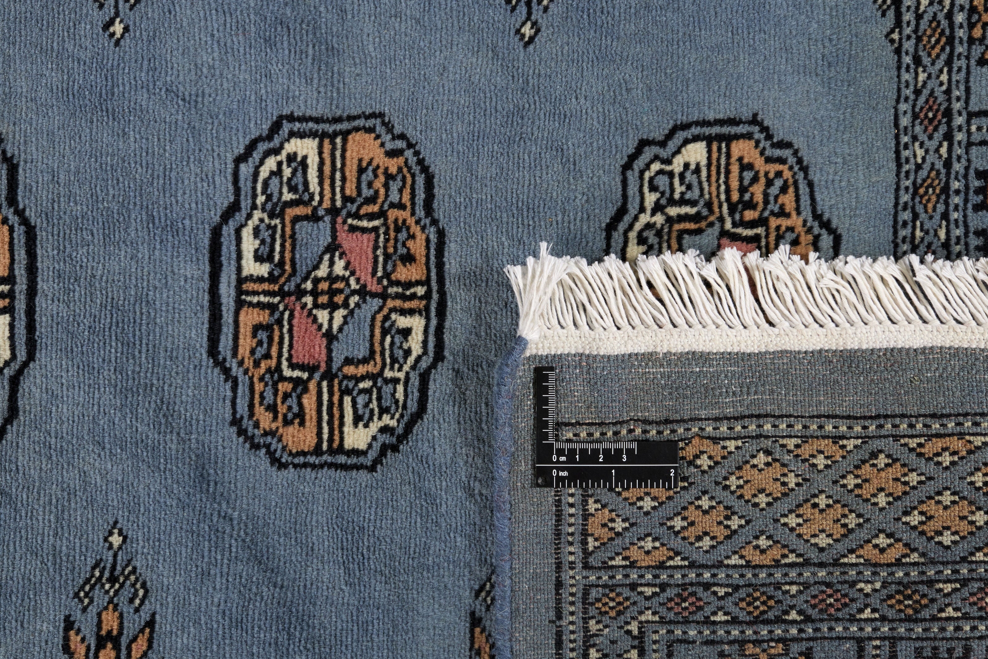 Blue Oriental runner with traditional bordered pattern