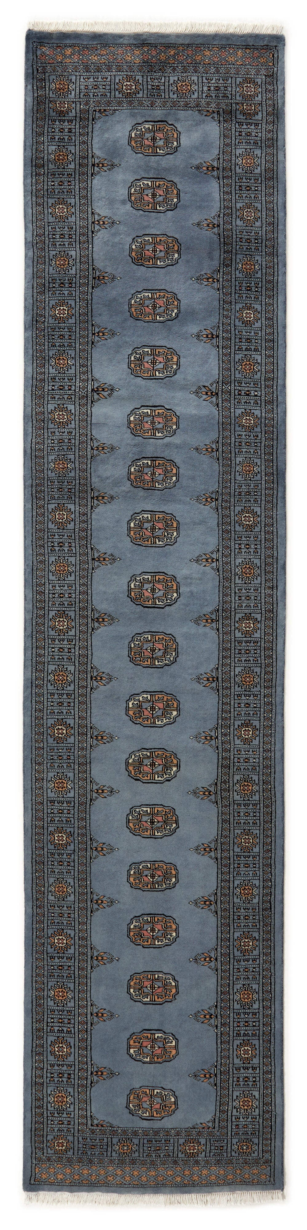 Blue Oriental runner with traditional bordered pattern