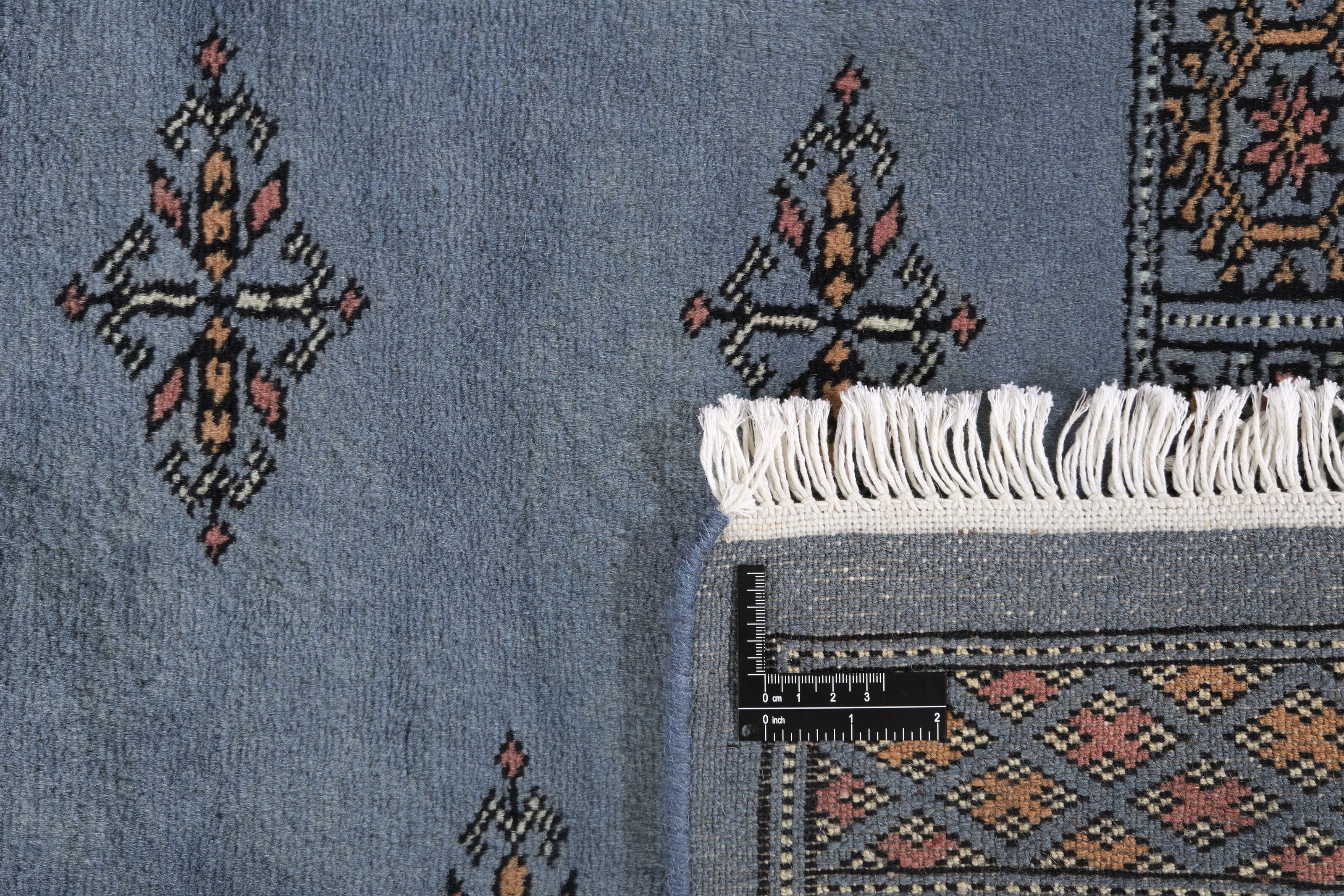Blue Oriental runner with traditional bordered pattern