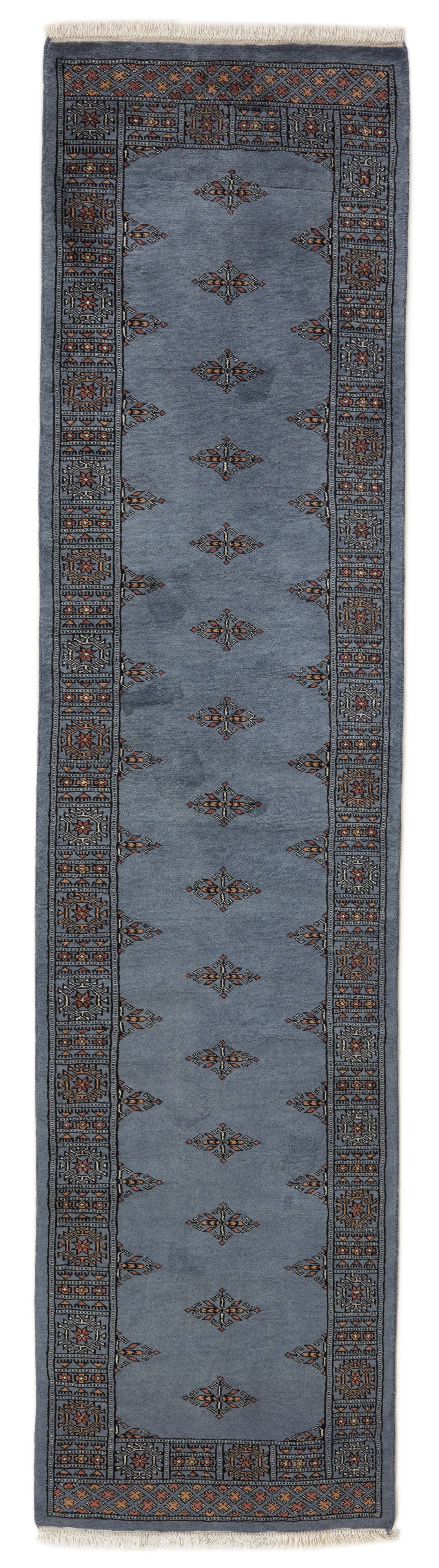 Blue Oriental runner with traditional bordered pattern