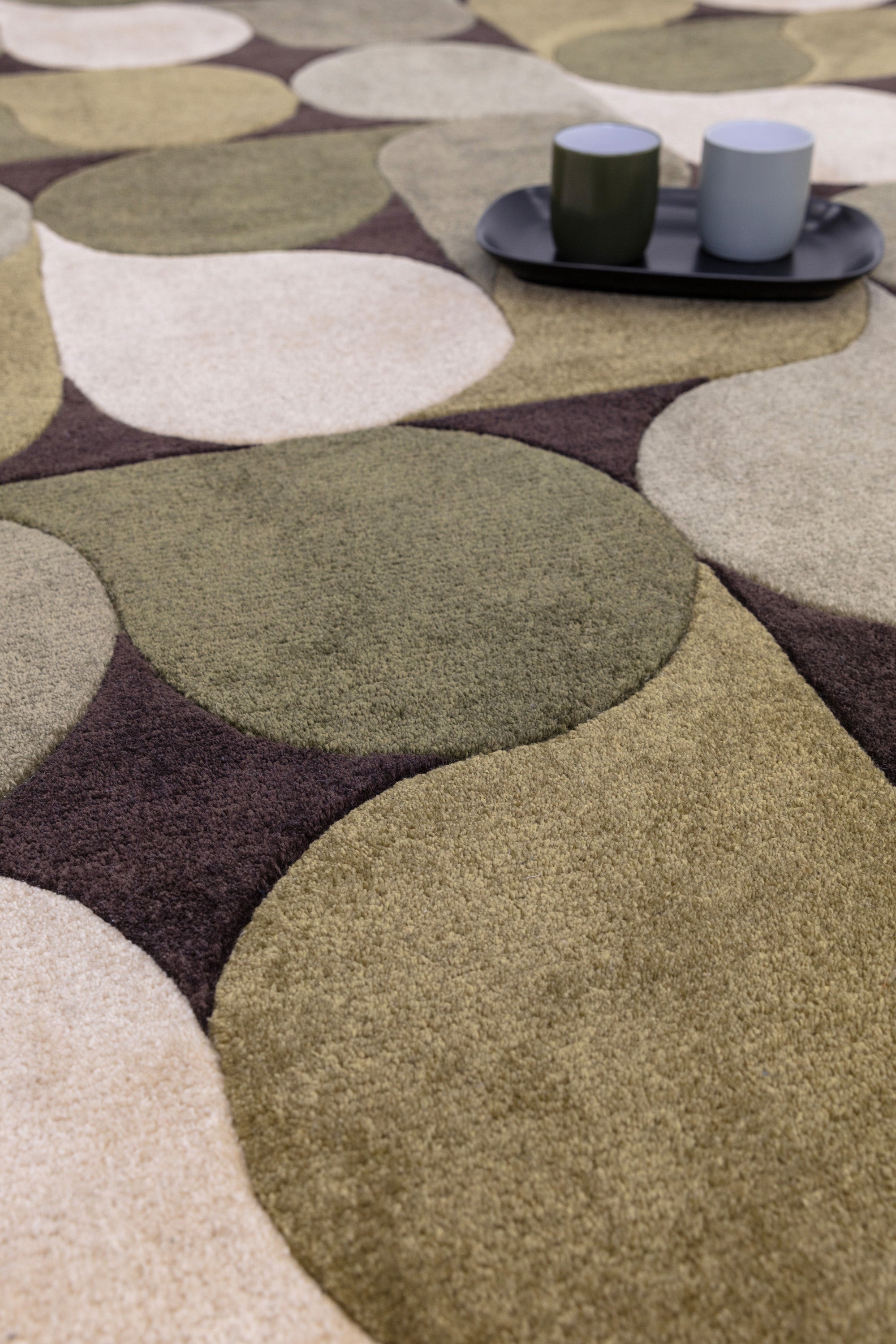 Green rug with an abstract pattern