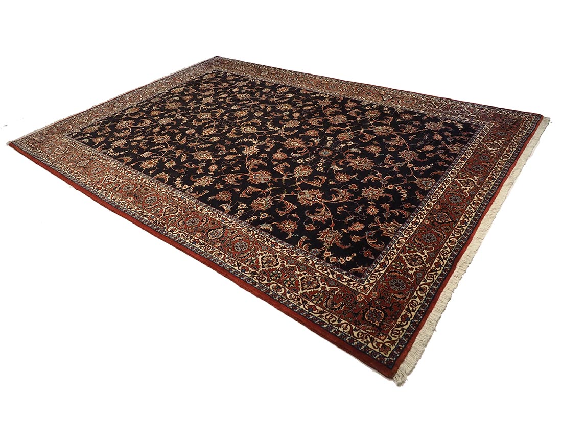 Red and black persian rug with traditional floral design