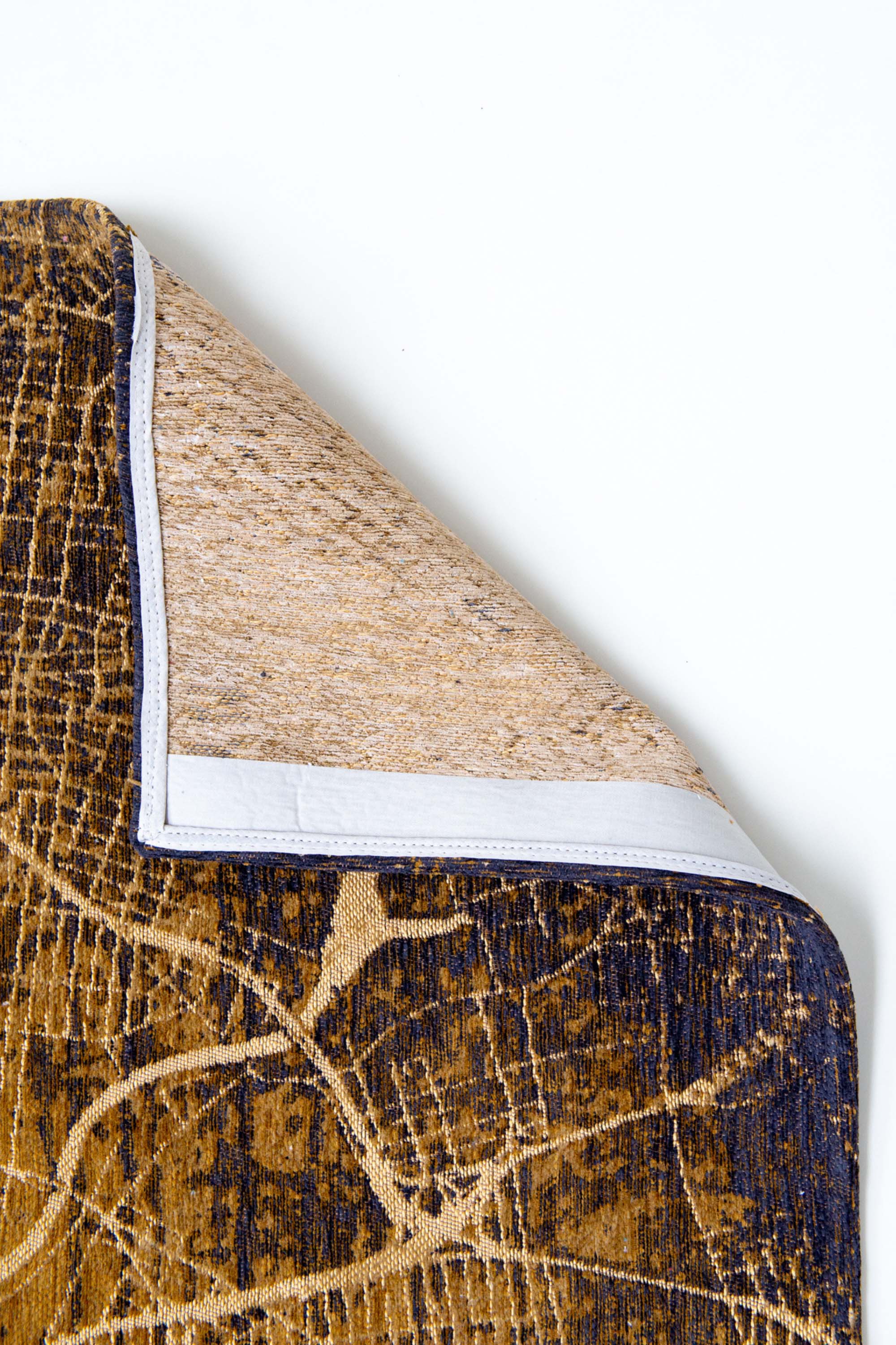 Gold abstract rug with a pattern inspired by the map of New York