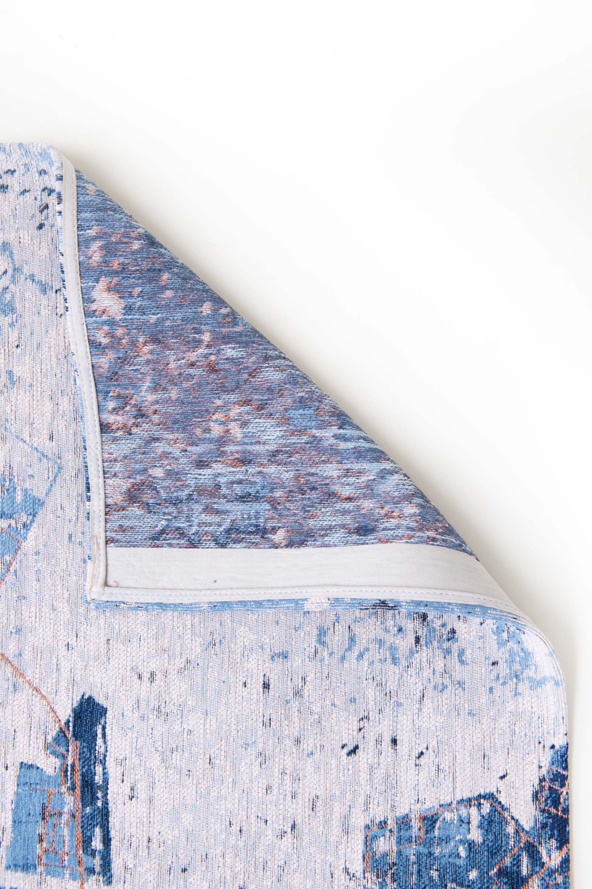 Blue abstract rug with a pattern inspired by the map of Tokyo