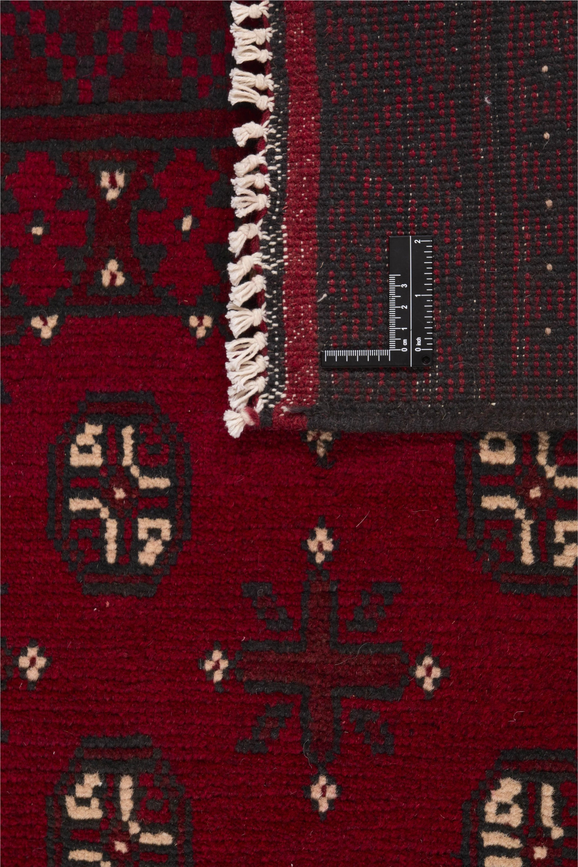 Red oriental wool runner with a traditional elephant's foot pattern
