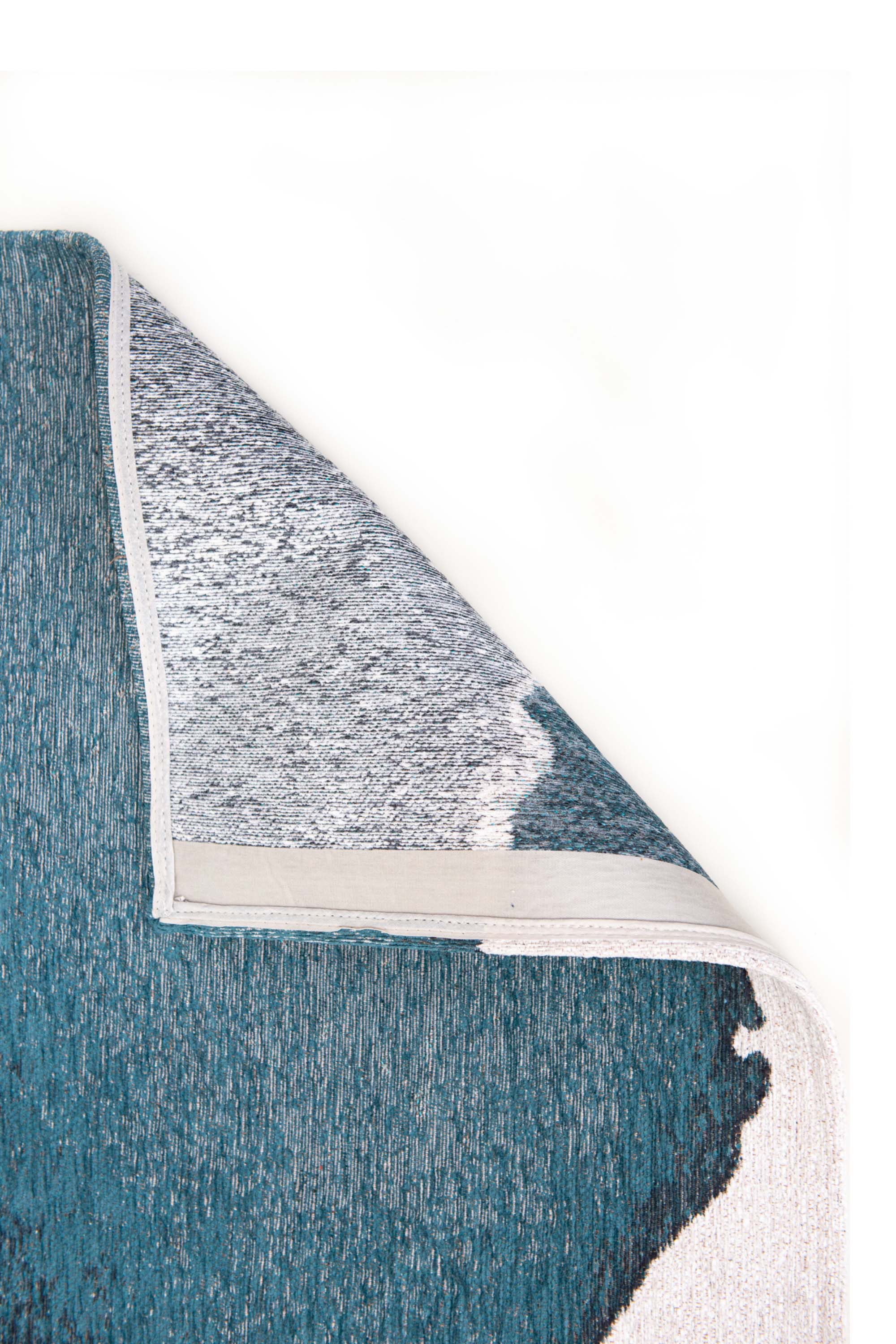 Modern rug with blue abstract shoreline pattern