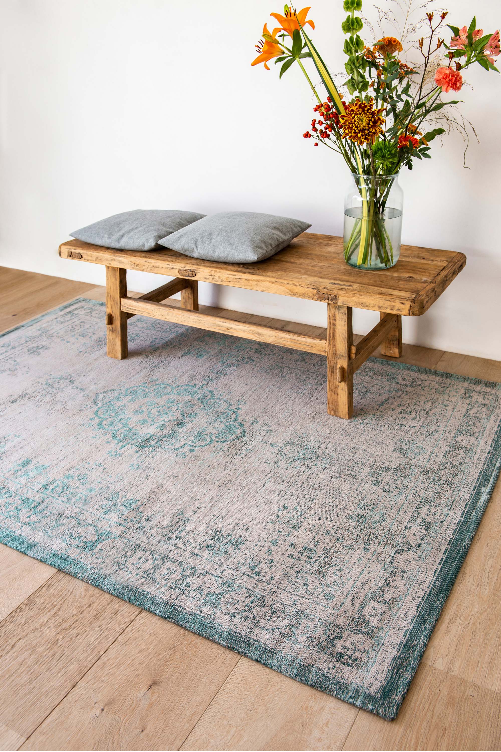 Grey flatweave rug with faded green persian design