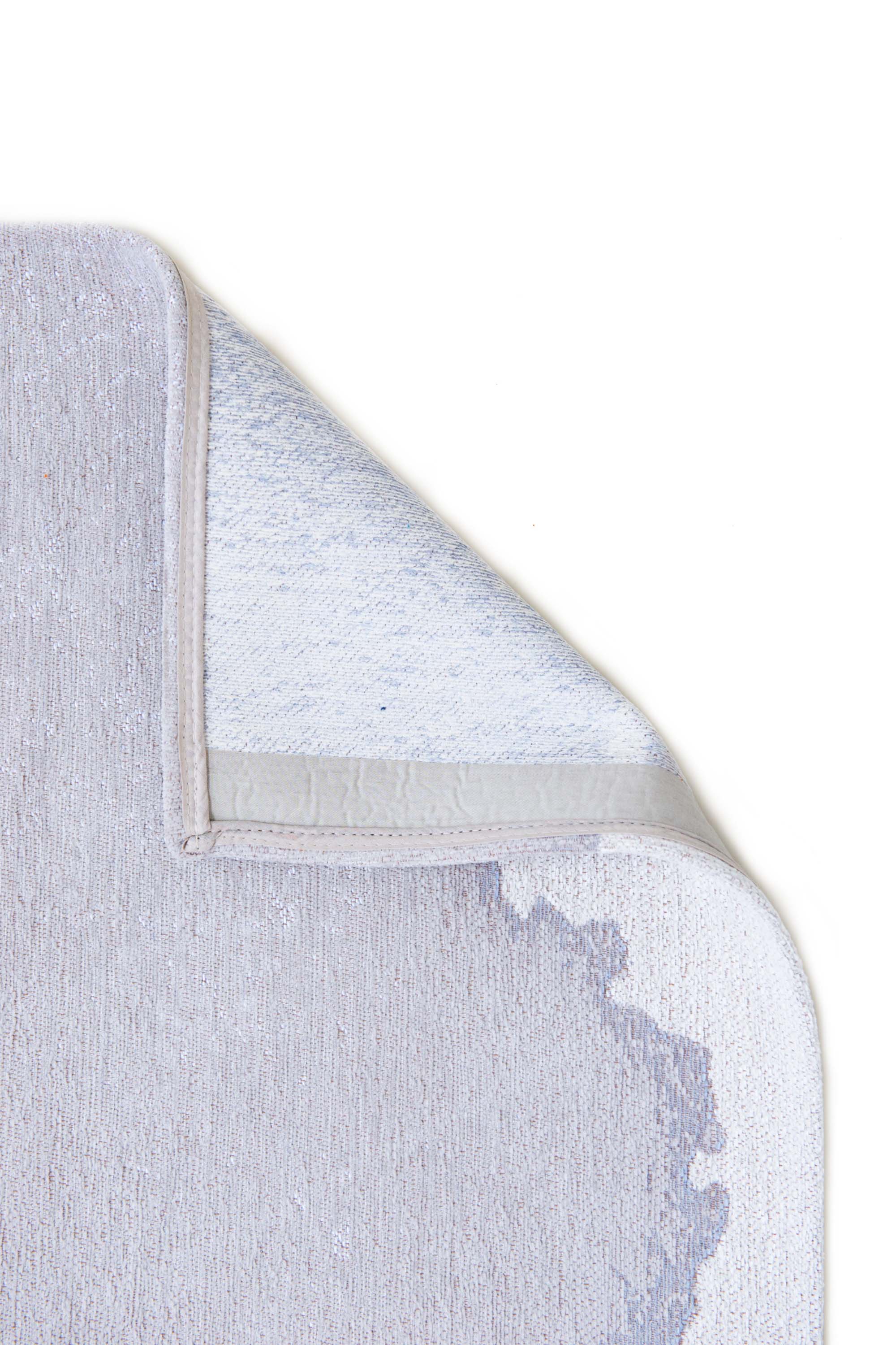 Modern rug with grey abstract shoreline pattern