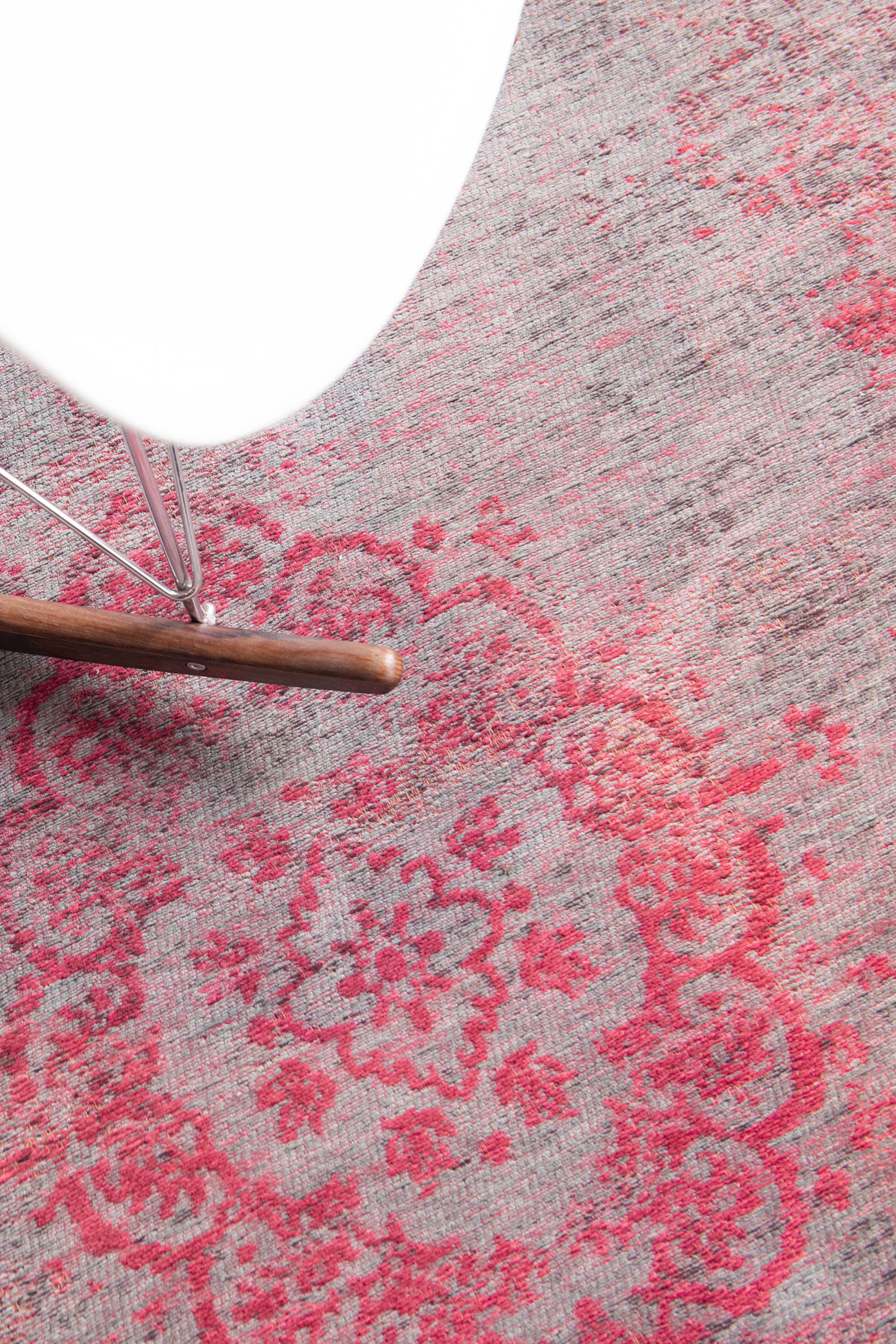 Grey and pink flatweave rug with faded persian design