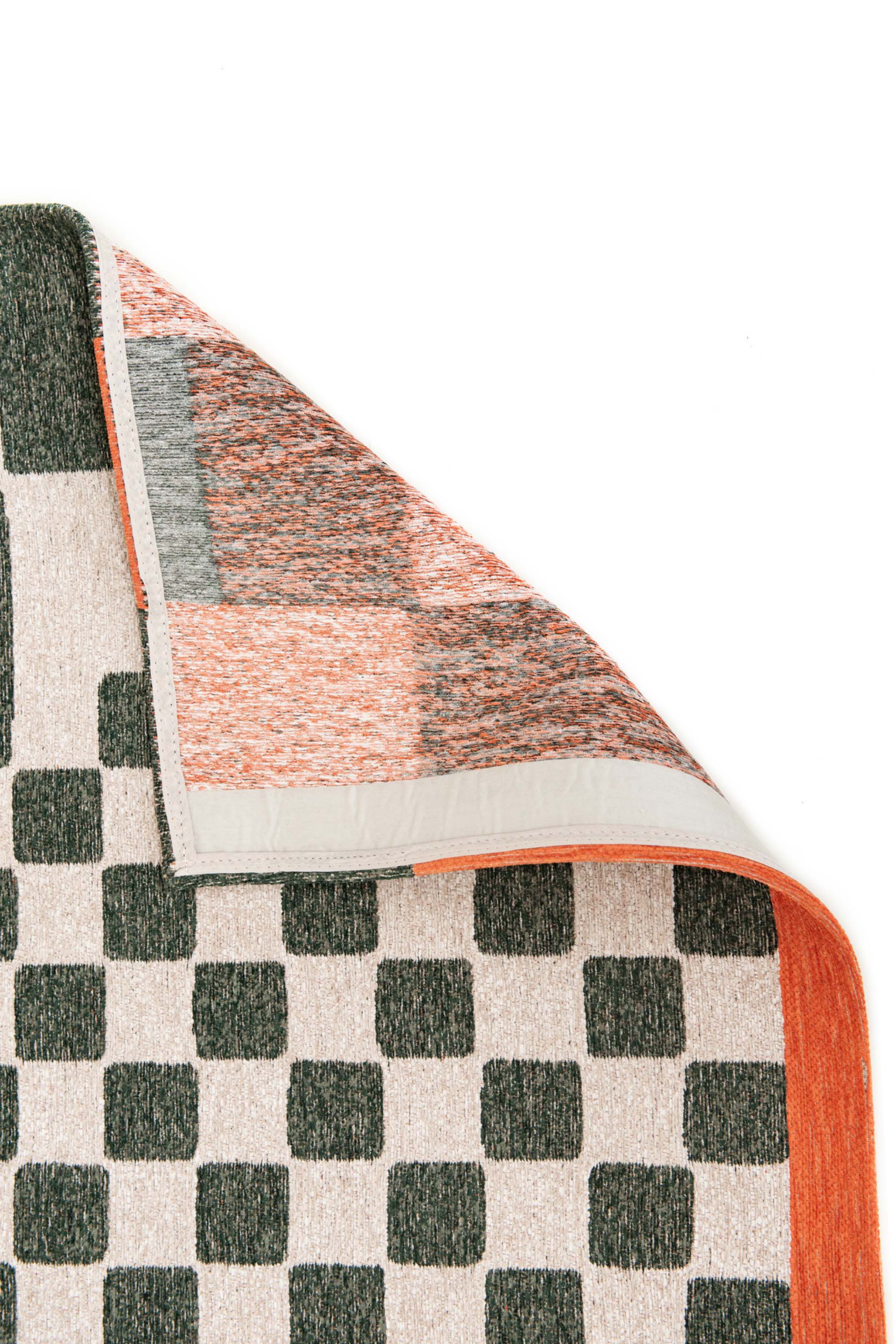 Abstract geometric rug with green, orange, and white tones