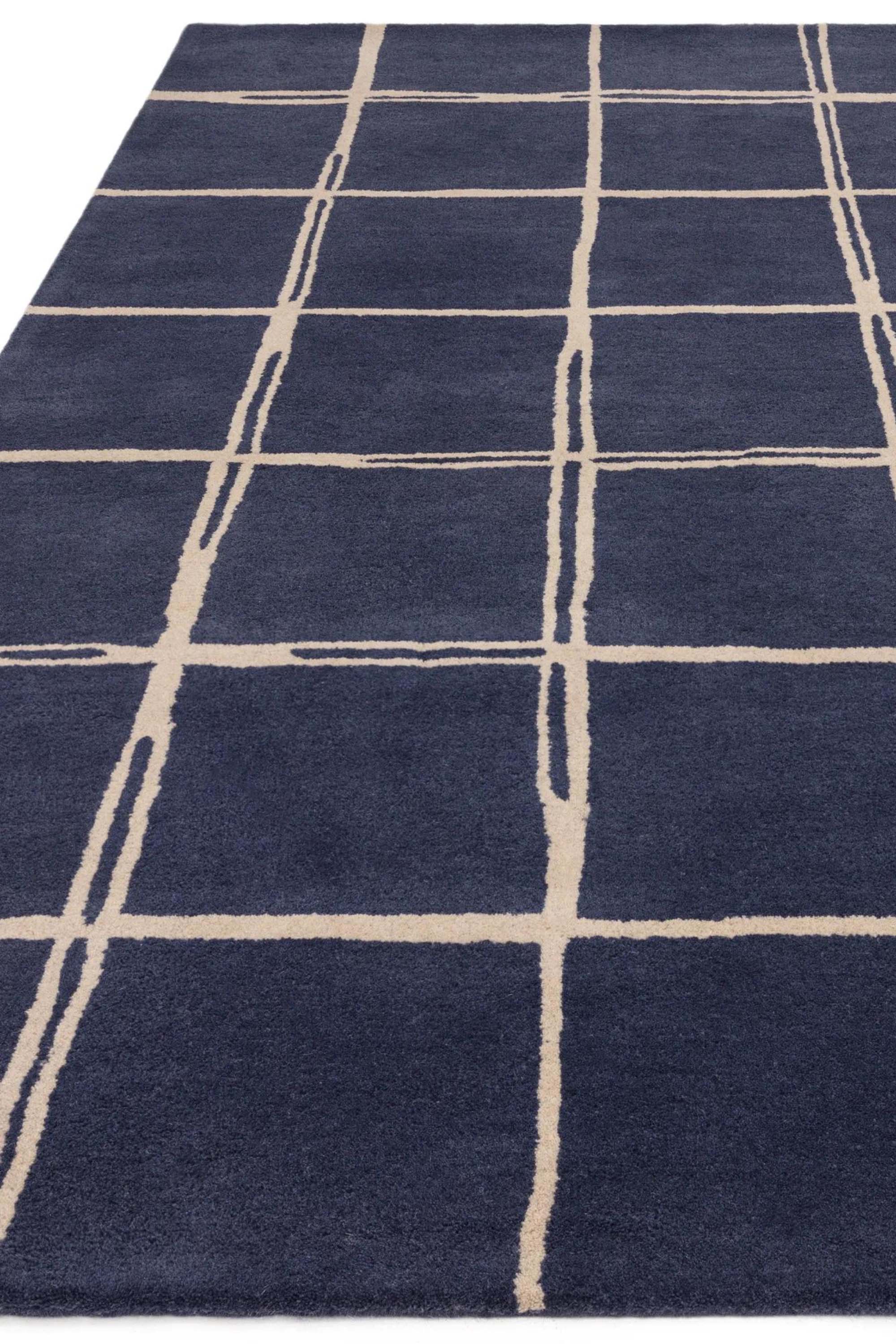 Blue rug with minimal geometric pattern