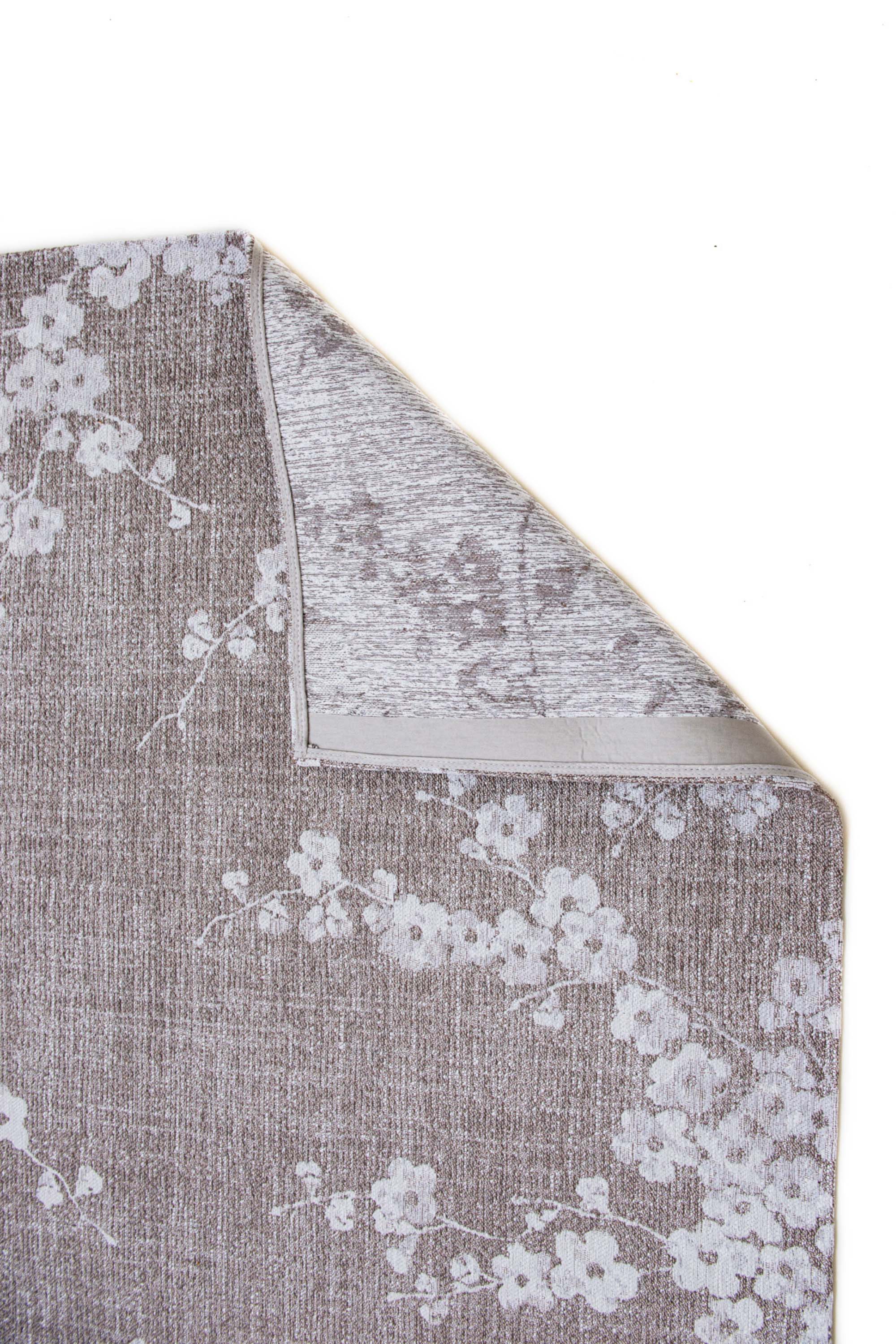 Modern abstract rug with subtle beige floral pattern