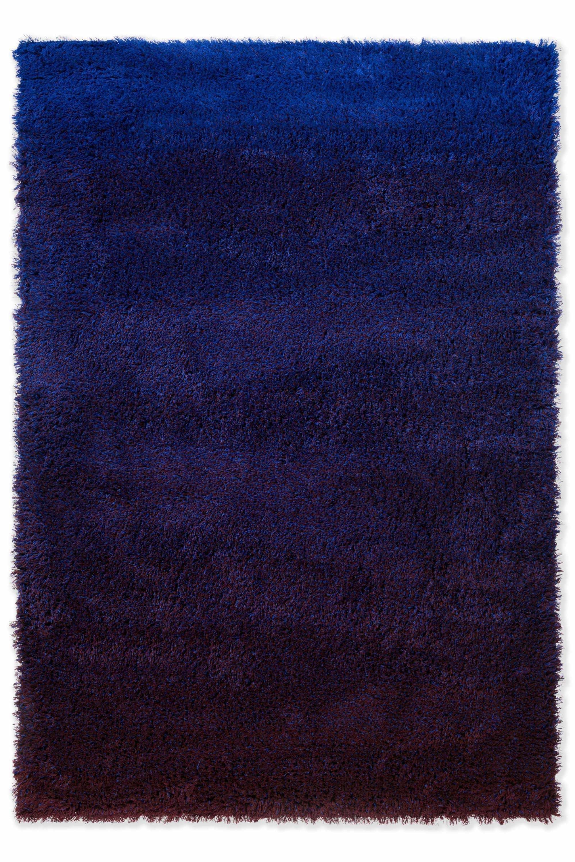 Plain blue rug with shaggy pile